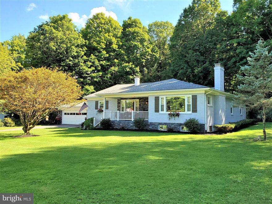 Prepare to be amazed by the quality of design and workmanship in this recently remodeled and updated 3 BR/2BA brick, ranch-style home.  Practically everything in this home has been afforded a high-end finish.  Beginning with the gorgeous, maintenance-friendly Canadian white oak flooring to the refreshingly functional kitchen with granite counter tops.  The lighting is phenomenal, with LED lighting throughout!  Other updates include the electrical, plumbing, and windows.  Another impressive feature of the home is the laundry room, located on the main floor.   Function is maximized with floor and wall cabinetry for storage and ample space for a sofa and chairs.  There are many small, but great features in this home, such as the hallway pantry, not to mention the front porch and breezeway sitting area.   Located in a rural setting, there is no better location to experience a peaceful setting and still have convenient and quick access to major roads/highways.  You'll need to see it to believe it!