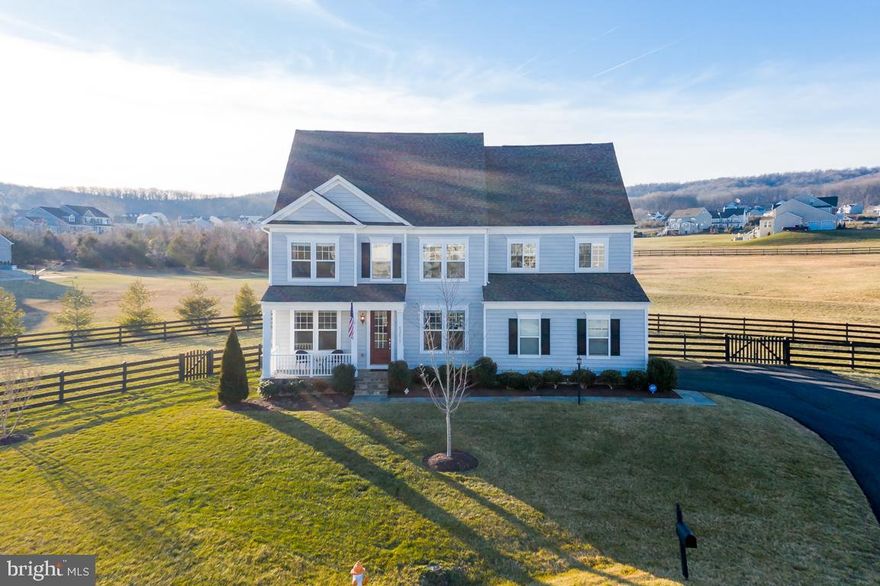 SIMPLY GORGEOUS, move-in ready Stanley Martin Carey Model home in Historic Selma Estates. Sellers have done all the right upgrades to your new home including hardwood throughout the main floor and upper floor landing, new, on trend lighting fixtures, new paint and new landscaping (oh, and the grass is ah-mazing) on over ONE-HALF ACRE! The main level offers a LARGE and LIGHT-FILLED open concept kitchen, dining and large, inviting family room. The GOURMET kitchen boasts TONS of cabinet space, a GIANT pantry, stainless steel appliances, a HUGE oversized island with storage, granite countertops, custom tile backsplash and updated pendant and dining lighting. The family room amazes with a rustic reclaimed wood feature wall and a slate surround gas fireplace to keep things cozy in the winter. The main level also has an office and formal dining room for entertaining. The upstairs welcomes you to a master suite FILLED WITH NATURAL LIGHT that has everything you need and then some; HIS AND HER WALK IN CLOSETS, a sitting room and a large, luxury en suite bathroom with his and her vanities, a soaking tub and oversized shower. Three additional, spacious bedrooms are on the upper level, two with walk in closets and one with its own en suite bathroom! A large third full bath with dual sinks ensures there are plenty of bathrooms for everyone!  The 4th level has a wonderful loft area that can be used as a game room, study or yoga retreat and a FIFTH BEDROOM     great for the older teen or guests! The lower level has a LARGE REC ROOM, FULL BATH and possible 6th bedroom! Don t worry, the basement also has PLENTY of STORAGE SPACE too. The large deck off the kitchen is PERFECT for taking the party outside and looks out on OPEN CONSERVANCY LAND (that will never be built on) and PICTURESQUE MOUNTAINS. There s also plenty of room to run around and even add an in-ground pool! All of this and tucked away on a QUIET CUL-DE-SAC too! But wait, there s more, you re just TEN MINUTES from charming downtown Leesburg, minutes away from several wineries, breweries and other treasures of Leesburg including: White's Ford Regional Park, Ida Lee Recreation Center, Loudoun County Rust Library, Historic Morven Park, Equestrian, Tally Ho Theatre, Leesburg Village Center including Wegmans & many Restaurants & Shops, as well as Cobb Theatre, Leesburg Premium Shopping Outlets, MANY wineries and breweries, Roots Cafe and Local Market, The Old Lucketts Store (great Antique Shopping), Farmer John's Fruit & Vegetable Market, The Marshall House, Historic White's Ferry, Oatlands Plantation, Temple Hall Farm Regional Park, Leesburg Animal Park and Public and Private Golf Courses. In addition, Frederick, Maryland is a short 30-minute drive, with many restaurants, shops, and historic sites. The Appalachian trail is a 30-minute drive and Shenandoah State Park is a one-hour drive with camping sites and facilities, restaurants, and walking trails. This one won t last long, schedule your showing today!