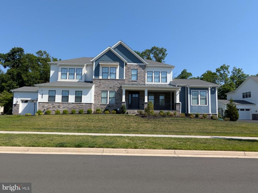 An extraordinary expression of quiet luxury and modern organic design, this exceptional Toll Brothers Rosslyn estate offers elevated living in the heart of Lenah Mill. Perfectly positioned on a premium 0.48-acre homesite backing to mature woods, the residence blends architectural sophistication with warmth, serenity, and effortless functionality.

Crafted in 2022 with over 8,100 finished square feet across three thoughtfully designed levels, the home features 6 bedrooms, 6 full and 1 half baths, including a beautifully appointed main-level multi-generational suite with private exterior access. Expansive windows, soaring ceilings, wide-plank hardwood floors, custom millwork, and oversized stacking glass doors create an atmosphere that feels both refined and deeply inviting.

At the center of the home, the chef’s kitchen is curated with Wolf, Sub-Zero, and Asko appliances, bespoke quartz surfaces, and a fully equipped prep kitchen designed for seamless entertaining. Every detail has been intentionally selected, from designer lighting and custom closets to motorized Lutron shades, a private theater, whole-home water filtration, and fully owned solar panels.

Outdoor living unfolds beautifully with a covered rear porch, expansive patio, and peaceful wooded backdrop, offering privacy and connection to nature. A rare four-car garage, extended driveway, and extensive luxury upgrades complete this remarkable offering.

Set within one of Loudoun County’s most coveted lifestyle communities, residents enjoy access to resort-style amenities, top-tier schools, scenic trails, and effortless proximity to dining, retail, Metro access, and Dulles International Airport.

A home of this caliber is not simply lived in — it is experienced.