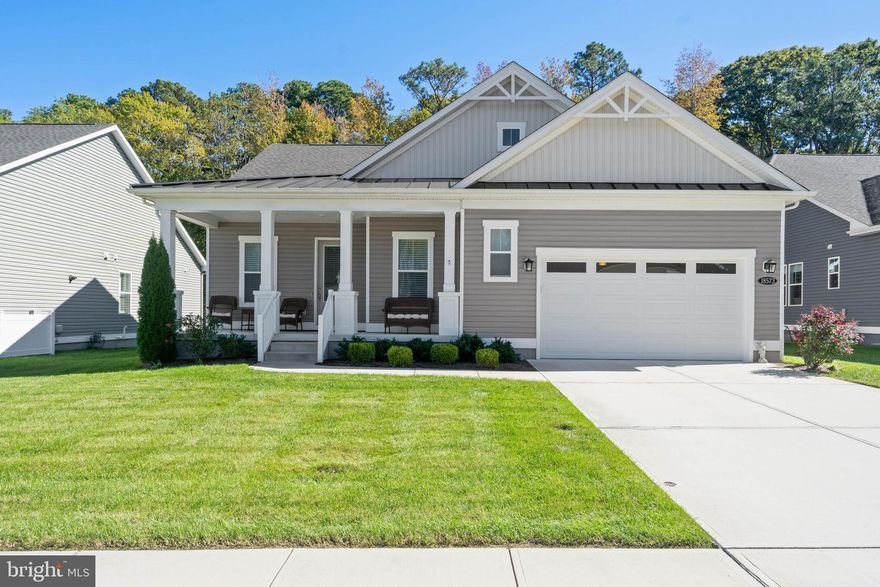 Refined One-Level Living on a Premium Homesite in Hawthorne!  Experience elevated coastal living in this beautifully appointed 3 Bedroom, 2.5 Bathroom residence offering 1,924 sq ft of thoughtfully designed single-level living.  Built in 2021 and ideally located between the charm of Georgetown and the coastal appeal of Lewes, this home combines modern sophistication with timeless comfort in one of Sussex County’s most desirable communities.  From the moment you enter, you are welcomed by soaring 12 foot ceilings and an open, light-filled layout designed for both effortless everyday living and elegant entertaining. The heart of the home is a gourmet chef’s kitchen of exceptional scale and style, anchored by a dramatic 12 foot quartz island and appointed with double wall ovens and a five burner gas cooktop. Seamlessly connected living and dining spaces create a refined yet relaxed atmosphere. An expanded owner’s suite, extended by four feet as a premium construction upgrade, offers a more spacious and private retreat. The ensuite bath evokes a spa-like experience, complemented by upscale finishes, while beveled edge luxury vinyl plank flooring flows throughout the main living areas for a clean, cohesive aesthetic.  Set on a premium homesite selected for its privacy and natural beauty, the property backs to a protected forest, an upgrade that offers a rare sense of seclusion and tranquility.  Outdoor living is equally exceptional, featuring a screened porch with a gas fireplace wrapped in a striking stone facade, creating a year-round gathering space that feels both intimate and refined.  A welcoming covered front porch adds to the home’s charm and curb appeal.  Additional high-value upgrades include a full lawn irrigation system servicing both front and rear yards, as well as interior access to the crawlspace via a full door and staircase leading to a concrete floor, offering convenience & storage rarely found in homes of this kind.  Residents of Hawthorne enjoy a vibrant community setting with close proximity to the beaches, dining, and recreation that define the coastal Delaware lifestyle. This is a rare opportunity to own a thoughtfully upgraded, impeccably maintained home where comfort, privacy, and quality come together seamlessly.  Fiber free home (i.e. no carpet).