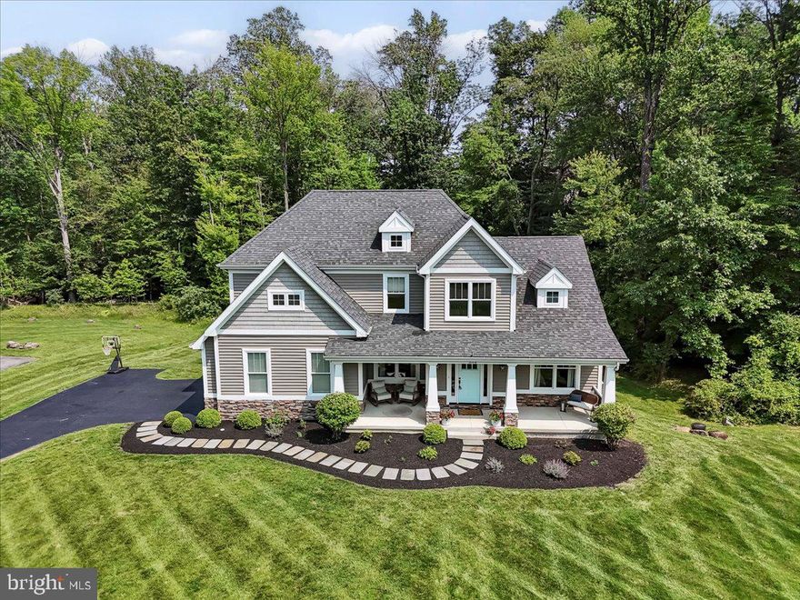 A truly exceptional, one of a kind, custom built colonial style home with so many upgrades, and no detail overlooked;  featuring 4 spacious bedrooms, 3 full bathrooms, a fantastic finished walk out basement and is nestled on an astonishingly beautiful  1+ acre lot backing to a peaceful meandering brook and serene woods in the lovely established neighborhood of Laughead Ln.  This stunning home is just around the corner from the elementary school and is centrally located in the heart of Garnet Valley and top rated Garnet Valley Schools as well as countless family amenities that Garnet Valley is known for.  A welcoming covered front porch and facade adorned with timed uplighting and beautiful stone walks into a lovely open functional layout  with 9' ceilings and wide-plank, hand-scraped Espresso finish oak flooring flowing throughout the main level and extends to the staircase and 2nd floor hall,  lots of natural light via grand windows that look out over a large maintenance free deck spanning the width of the home and overlooking breathtaking views out over a lushly landscaped yard featuring a new patio and  fire-pit as well as a fantastic play area for the kids. The gourmet kitchen is a chef's delight with a 36" Wolf gas range top, professional vent hood, microwave drawer, double ovens, pot filler, farm sink, marble counters, 42" soft close cabinets, a large center island and a walk-in pantry.  The family room with its wall of windows affords lots of lovely views out over the backyard and abundant natural light. The dining room is conveniently located adjacent to the kitchen and family room, and there is also a main level private office, a main level bedroom that is perfect for a guest bedroom or in law quarters,  a full bath and convenient inside access to the spacious 2 car garage completing the main level. On the upper level of this spectacular home, you'll find an exquisite primary suite with a large walk-in closet, a newly renovated en-suite bath that has a soaking tub, dual sinks with vanity space, a tiled shower and a separate water closet. Two additional spacious bedrooms share a jack-and-jill bath, and one of the bedrooms includes an extra sitting area room; perfect for a playroom or extra storage. The laundry is also conveniently located on the upper level.  The newly renovated finished walk-out basement has 9' ceilings and will impress with its theater area, workout room and new Gym-Tech Deck.  This truly exceptional home is move in ready.  Make an appointment to come see this one of a kind stunner or come to the open house scheduled for Saturday June 14th from 12 PM to 4 PM before its too late.*** Offer Deadline; The sellers request all buyers submit their highest best and cleanest offer by Monday June 16th at 5 PM for review.  Thank you for your  interest in this exceptional home*****