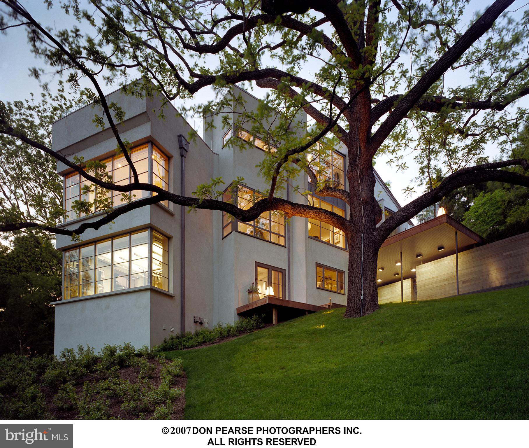 Etched into a verdant landscape of 2.46 acres in sought-after St. Davids rests a masterfully designed luxury retreat with no detail unturned or expense spared. Ultra-private and secluded, this majestic Julip Run estate set on 2 large parcels is an oasis of artful living, enveloped in soaring trees & enchanting gardens, boasting a contemporary 9,238 sf Main House with captivating negative-edge pool. Abundant water features, manicured outdoor areas & expansive IPE decking heighten the appeal, along with a 3,956 sq ft Guest House, richly appointed for guests with a loft, living area, full kitchen, bedroom, full bath & upscale garage bays. For the collector, connoisseur or curator of life, this residence is the pinnacle of sophisticated yet livable architecture & design. Upon arrival, an elongated driveway sets the tone with vibrant flora & fauna, met by sleek lines, exquisite stonework, and thought-provoking sculpture. At once organic and modern, this one-of-a-kind property is a feast for the senses as every angle reveals something awe-inspiring and new. Step inside to marvel at the array of exotic designer touches, from the interior water feature sited below a circular stair landing, to a custom Rosewood fireplace façade that serves as an eye-catching focal point in the living room. Here, 2-coat veneer plaster walls & ceilings abound for showcasing art with specialized lighting, coupled with Bolivian Rosewood floors to warm the gracious living room, dining room & private study. Decorative glass panels & doors lend a seamless visual throughout, while soft lighting brings depth and drama in every room. Gorgeous Birds Eye Maple adorns the stunning family room and gourmet kitchen, which comes fully equipped for the chef with top-of-the-line built-in appliances, ample custom cabinetry, and a generous center island & pantry. Custom fabricated cabinet pulls, range hood & pot rack with integral lighting, plus a convenient catering kitchen complete the picture. For the ultimate relaxation, the tranquil primary suite leaves nothing to be desired. It affords a spa-like ambiance, wrapped in custom Rosewood paneling & built-ins, including a dressing cabinet, desk, kitchenette & stairs to a private loft. This is enhanced by a relaxing fireplace & magazine-quality bath featuring a luxurious oversized rain shower with multiple sprays and wall-to-wall slab stone & glass, creating an immersive experience where nature takes center stage. Just outside is your private sanctuary complete with hot tub, roof deck & outdoor atrium. Take a dip in the sparkling pool, meditate in the gardens, work up a sweat in the home gym, or fire up the grill in the custom teak & stainless steel barbecue enclosure. Everything is incorporated for a lifestyle without compromise. Additionally, a spectacular Walnut wine cellar, radiant heat flooring in the living, dining, study, entire primary suite level & garage, fully-integrated Lutron lighting, Tischler and Sohn + custom fabricated lead-coated windows & doors with motorized roll screens & shades, a roof heat trace system, and emergency generator are but a few of the enticing upgrades. Rest assured, this home is as secure as they come. It’s located on a street with no through traffic offering ultimate privacy. Outside security cameras monitor the property beginning at the driveway and continue to the motor courts, pool area and every door entrance. There are glass break sensors on all doors and windows connected via a hard-wiring system. Every door has a dead-bolt lock and all keys are unable to be duplicated. As one of the most desirable enclaves in St. Davids, this exclusive suburb is distinguished by its rich history, serene atmosphere, top-notch academic institutions, and prime locale in the heart of the Main Line for easy access to the greater Philadelphia metro.
There are two properties being sold as one. Two Tax IDs 308 Julip Run & 310 Julip Run 36-03-01645-05 & 36-03-01645-06.