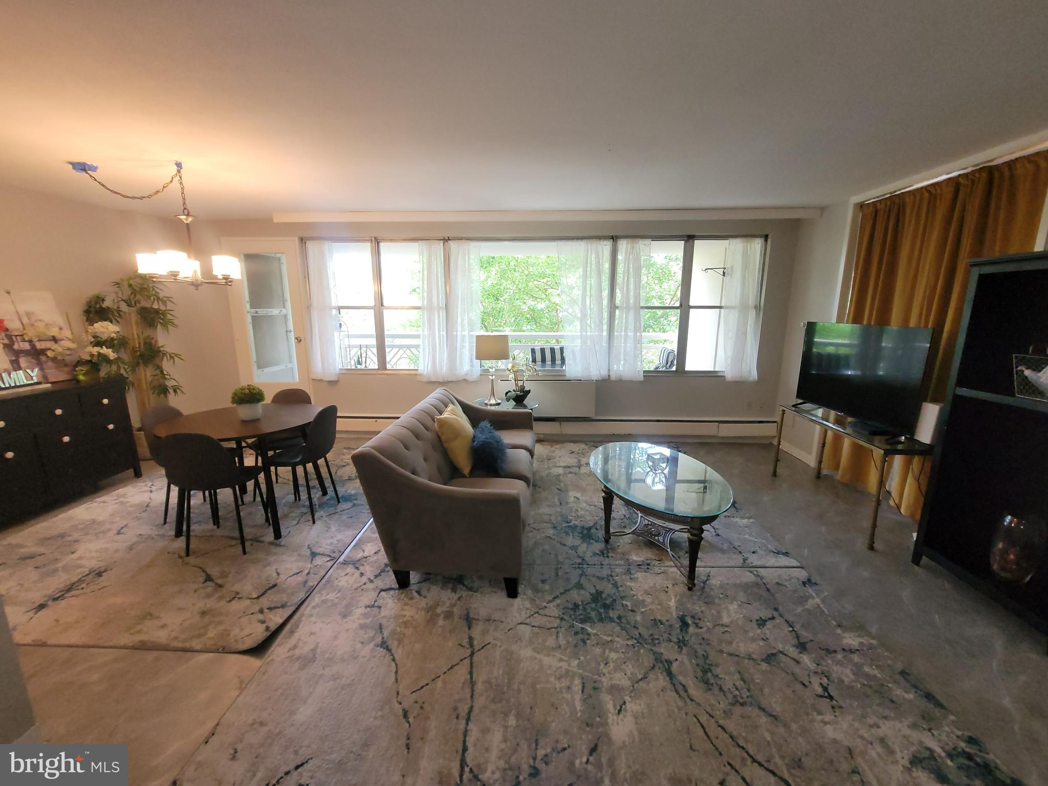Welcome to this beautifully appointed, sun-drenched ​condominium perched on the ​5th floor of the Elkins Park House. This expansive two-bedroom, two-bathroom residence offers a thoughtfully designed layout that perfectly balances comfort, style, and functionality—ideal for both everyday living and effortless entertaining.
Step out onto the generous private balcony overlooking serene treetop views—an inviting space for morning coffee or al fresco dining. Inside, a warm and welcoming foyer leads into an open-concept living and dining area, where wall-to-wall windows flood the space with natural light.
The kitchen boasts rich wood cabinetry, abundant counter space, stainless steel appliances, gas cooking, a built-in microwave combining form and function with timeless appeal.
The spacious primary suite features a large bedroom, a private bath, and an oversized walk-in closet. The second bedroom—equally well-suited as a den or home office—includes a custom built-in wall unit​, a well-appointed hall bath offers a tub/shower combination​.
Condo fees conveniently cover all utilities except electricity. Residents enjoy 24-hour doorman service and on-site amenities including a restaurant, dry cleaner, fitness room, community patio, and in-ground pool.
Ideally located within walking distance to the regional rail station, bus routes, shops, and parks, this home offers exceptional convenience and lifestyle. Easy to show with immediate possession available.