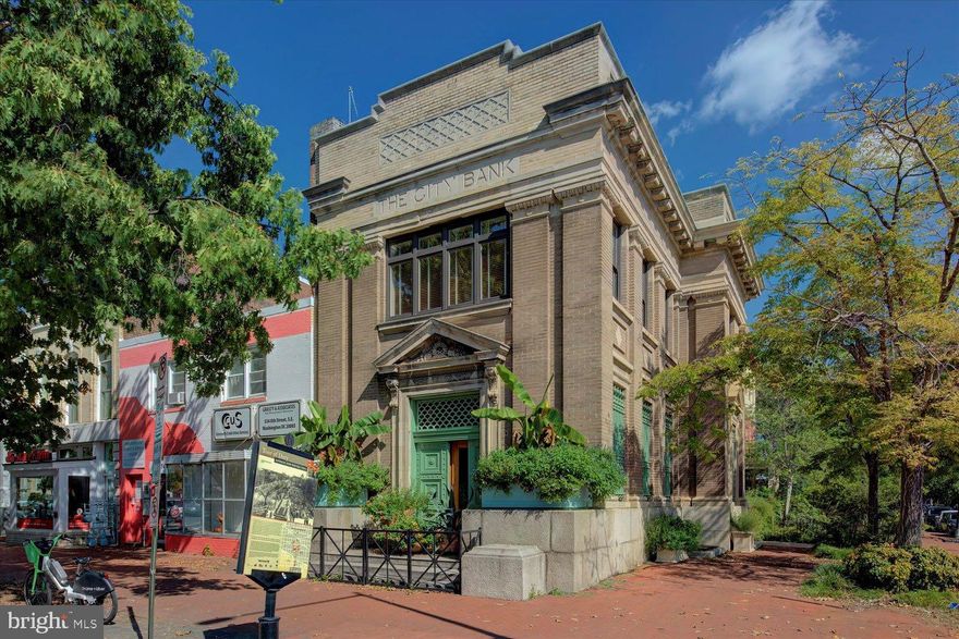 Iconic three level all brick City Bank Building with classical architectural located on 8th & G Streets in SE Capitol Hill, Washington DC, across from the Marine Corps Commandant's home, just steps from Pennsylvania Avenue. Renovated with elegant front doors, vestibule, huge windows, high ceilings, egg and dart crown molding with frieze, coffered ceilings, brick pilasters, recessed lighting with pendant hanging light fixtures. The historic architectural design exudes strength, security and stability. Suitable for a learning institution, corporate headquarters, Embassy, Architecture firm or similar use.  Connected to a residential townhouse with hardwood stairs, railing and balusters, perfect for pied a terre corporate use.  Approximately 7,000 combined total finished square feet on almost 3,000 square feet of land. Built in 1908. Two single bay parking garages included nearby. Walking distance to US Capitol, DC Metro. Plentiful restaurants, coffee shops and retail nearby. 10 minutes to National Airport. Zoned MU-25 (Commercial) and RF-1 (Residential).