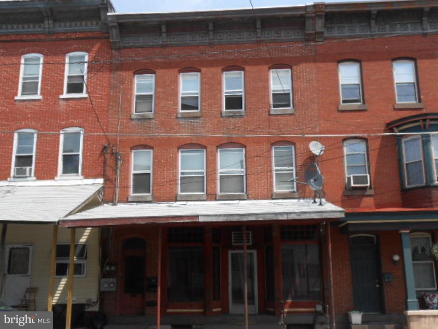 Investors here is a 3 Unit Brick Apartment building  also has a detached 2 story garage in rear area. 3rd floor was redone a few years ago.All apartments are spacious rooms. Open stairway to upper levels. Back yard area.Each unit has their own hot water heater the  tenant is responsible for electric & trash.Income property, Live in one and rent the other 2 units.Pine Grove School District.  Trash Expns: Tenant, Amps/#Meters: 100/4, Maintenance Exp: N/A