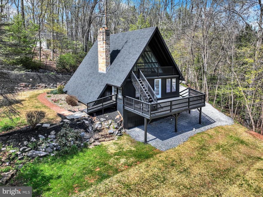 Nestled on 2.67 acres at the end of a quiet dead-end road, this charming 3-bedroom A-frame home overlooks a peaceful creek, offering the perfect blend of comfort and seclusion. Featuring an open floor plan, 2nd floor loft and a cozy stone fireplace, the interior flows effortlessly, while the finished basement provides extra living space with direct access to the attached garage. the windows allow plenty of natural light. A detached garage adds even more storage or workshop potential. Step outside to a spacious two-story deck—ideal for enjoying the surrounding nature and entertaining guests in style.