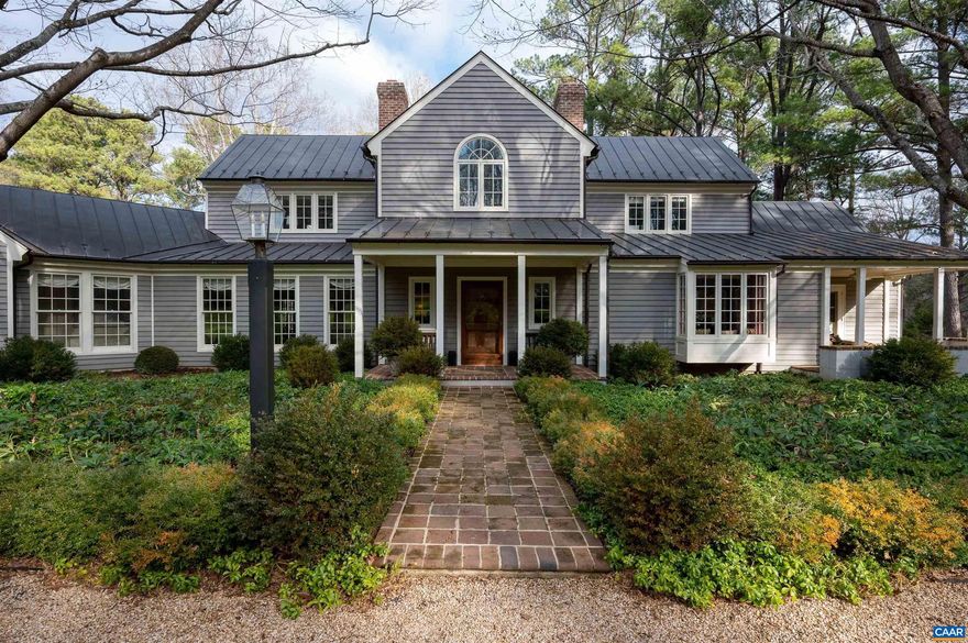 Exceptionally rare offering in Western Albemarle! Surrounded by large farms and estates, this beautifully constructed 4-5 bedroom, 4.5 bath custom home is nestled on just under 9 park-like acres with mountain views and wonderful privacy yet is only minutes from Birdwood Golf Course, Boar's Head Resort & Sport's Club, the University of Virginia and Downtown. The home boasts a fantastic floor plan with rooms of generous proportion ideal for easy living and entertaining, a delightful primary bedroom wing, sophisticated mouldings and trim, 8" white oak plank flooring, 9ft and 10ft ceilings, 3 wood-burning fireplaces copper roof and gutters, clear fir siding, and multiple covered porches. Superb craftsmanship, quality materials, gorgeous setting, great location, and excellent schools!,Glass Front Cabinets,Quartz Counter,White Cabinets,Fireplace in Den,Fireplace in Living Room,Fireplace in Rec Room