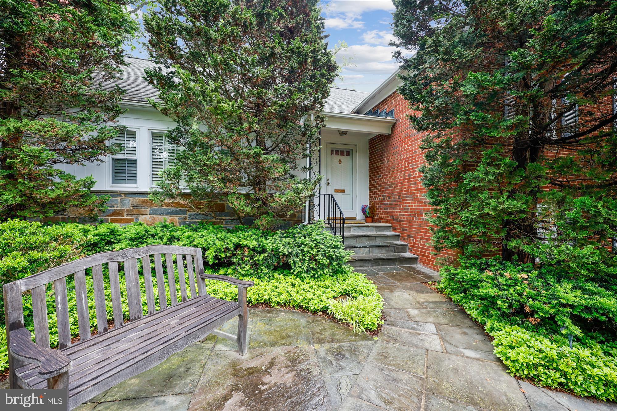 Welcome to this lush and lovely Bethesda home, in the Springfield neighborhood, literally down the street from Wood Acres Elementary. Updated in all the right places and well maintained over 46 years by the current owners, this home is ready for its next chapter. The sprawling floor plan features formal living and dining rooms, five bedrooms in all, an updated kitchen with white cabinets, a big skylight and quartz countertops, and the ultimate family room with a picture window to the lush backyard. In the cooler months, make use of any of the three fireplaces, including the remote-controlled gas fireplace in the spectacular family room -- this is THE room where everyone will want to hang out! Upstairs you’ll find the primary suite, two bedrooms and a hall bath. Up another level is the large loft bedroom, which can double as an office or workout room. Downstairs, is bedroom number five with an en-suite bathroom, a rec room with fireplace number three, and a laundry/storage room. Outside, the nearly third of an acre lot is beautifully landscaped and hardscaped, with a grilling area, equipped with a natural gas line – no empty tanks at the family BBQ! Outdoor improvements include exterior lighting and an irrigation system. When the backyard is in full bloom, it’s gorgeous! The two-car oversized garage is side entry, making the driveway a perfect place to shoot hoops. This prime location is close to shopping and dining including Whole Foods, Starbucks, and all that Westbard Square has to offer, and is just minutes from NW DC. This could be “the one!”