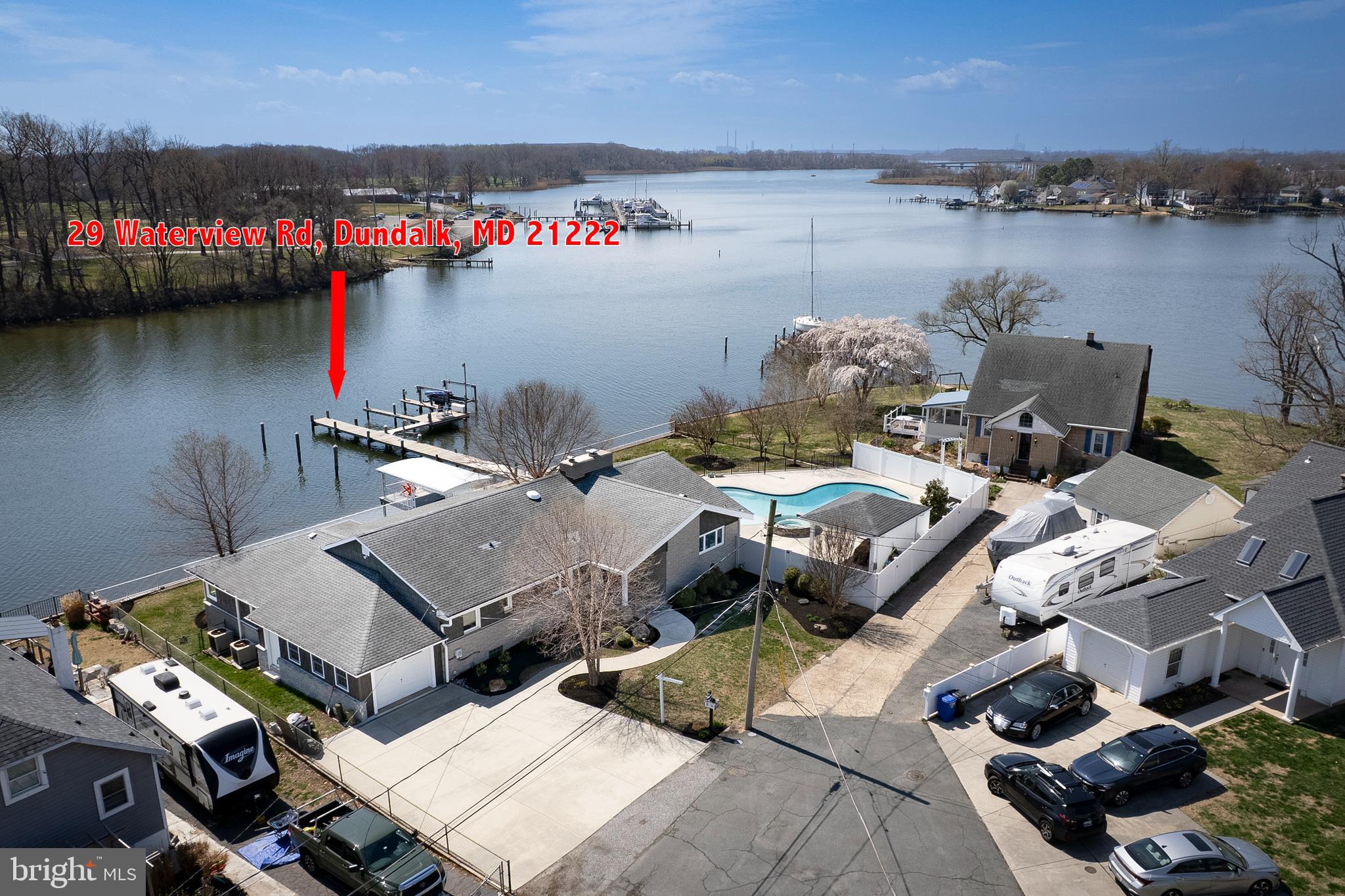 This is a unique opportunity to own waterfront with a pool in an extremely convenient location. This property has not traded since 1955. Here's what is now available after these 70 years:
Pull into your three car driveway, and if you want, park in your garage. Walk through your manicured front yard to the front door, throw your jacket in the closet and walk to your newly renovated kitchen. From the kitchen you will survey your 150+' waterfront, just over your in ground pool with with a huge space to entertain. Walk out to your pier with space for 5 boats, one 10,000# lift. If you would like, hang out by the water while you grill in the shade. When you are tired, come relax inside with great views of the water through all of the windows. Really tired from boating all day? It's time to crash in the main bedroom, where you have your own newly renovated bathroom. The rest of the space has another three bedrooms and another freshly renovated hallway bathroom. There is a basement, which connects with the garage.
Come take a look. Opportunities like this don't come along often.