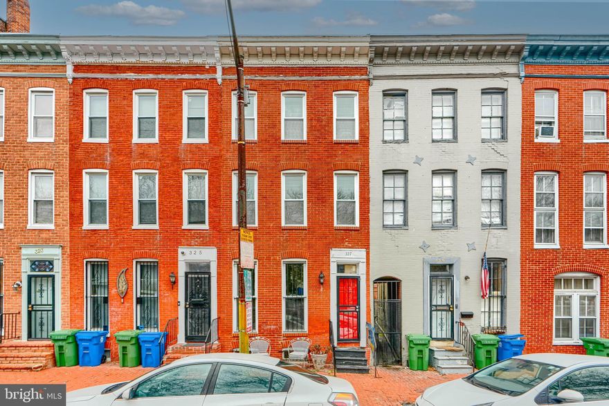 Wonderful opportunity to own in the hot historic Ridgely Delight neighborhood!  This charming three-bedroom, 2.5-bathroom home will check all the boxes on your “must have” list without breaking the bank.   This home has incredible historic integrity, with an original staircase, fireplace, and exposed brick, along with all the updates you desire for comfortable living.  The first floor includes hardwood floors, a convenient powder room,  designated dining, and access to a private patio.  Upstairs are two large bedrooms at the separate ends of the home for total privacy, and one full bathroom with a large tub.  The top floor is your private primary suite, with an additional washer-dryer hookup and an en-suite full bathroom.   The basement, equipped with a washer-dryer and a utility sink, is the perfect place for all your storage needs.  All of this is located steps from UMMC, UMBC, Camden Yards, JHU, and the Inner Harbor for well under 300K! This home is a no-brainer for the savvy investor looking to add to their rental portfolio or the first-time buyer on a budget.