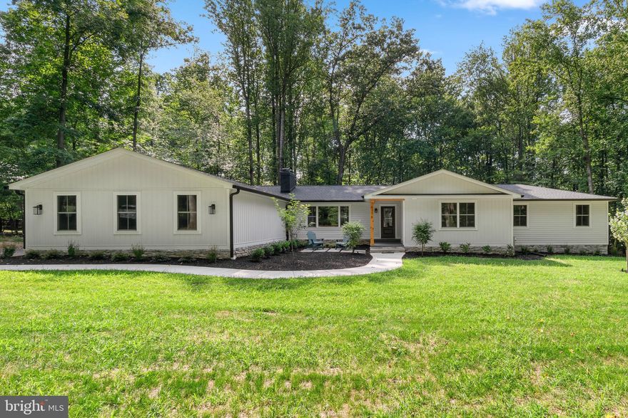 Builder owned. Complete renovation/additions in 2024. Open concept, fantastic kitchen with adjoining family room and keeping room. New siding, roof, insulation, HVAC, electric, plumbing, tankless hot water heater, appliances, septic, flooring, drywall, driveway. Three main level bedrooms have connecting
bathrooms. 16'x20' deck. Landscape lighting. One wood burning, one natural gas fireplace. Primary bedroom closet system. Cubbies at garage entrance. Garage pre-wired for electric vehicle. Whole-house fire suppression system. Sunny, walk-out basement via French door. Basement bedrooms each have twin double-hung windows - lots of light! Expansive game rooms. Beautiful, clean, modern farmhouse aesthetic. Wooded lot with great views and room for a pool. Did we mention deer??