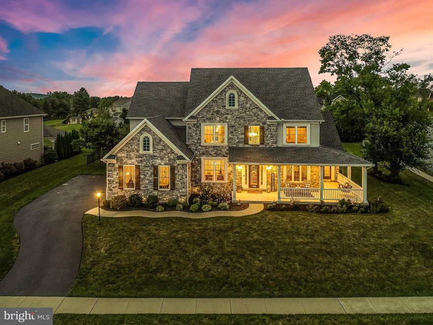 Amazing custom built home with so many features to list. This beautiful home features 4,482 square feet of living space. Sizeable wrap around porch, beautiful carefully designed landscaping, fenced in backyard with stamped concrete patio and heated pool. These are few of the features this home has to offer.  Entering the home you will find yourself in a bright two stories high foyer, open to a dining room clad with chair rails, tray ceiling and crown molding. Across a good size office with French style door awaits. Gorgeous hardwood floors are featured almost everywhere. A majestic living room opens up in front of you, with an impressive two story high stone fireplace drawing your eyes to the beautiful and classy coffered ceiling. You will enjoy entertaining in the custom built kitchen featuring, nice size pantry, granite counter tops and stainless steel appliances. A mud room with a pet shower for the “furry” child is also featured as well. The main level owner’s suite with walk-in closet, a roman style walk-in shower and soaking tub are also featured. You will reach the second level via dual connecting stairways where you will find another owners suite along with two additional bedrooms and baths, but not before you see the bright loft sitting area that takes in the beautiful coffered ceiling and majestic fireplace, while catching a glimpse of the beautiful backyard and skyline beyond. As if that is not enough, visit the lower level large family room with a wet bar and mini fridge,  a full bathroom with a large soaking tub for the overnight guests, and the most adorable under the stairs finished children play area with a little “window” and Dutch style door slide. The entertaining continues outside with the 660 square foot heated in-ground pool, patio area and pool-shed. This 2016 custom built home shows quality throughout and unmatched features.