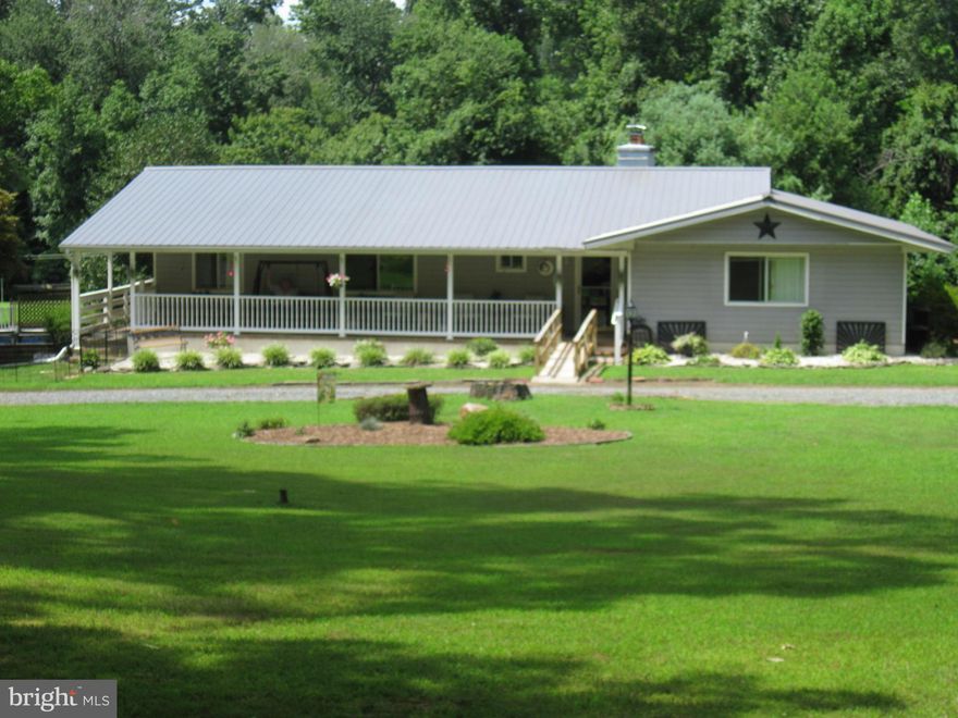 HUGE PRICE REDUCTION!  Wooded & Serene are just a couple words to describe this almost 7 acre home.  Compare before & after exterior pics for an amazing makeover.   LL could easily be an in-law suite, or just a family area.  There is a great room, kitchenette, full bath, two bedrooms and a gas fireplace.  Has a separate entrance from rear yard and a spiral staircase to main level.