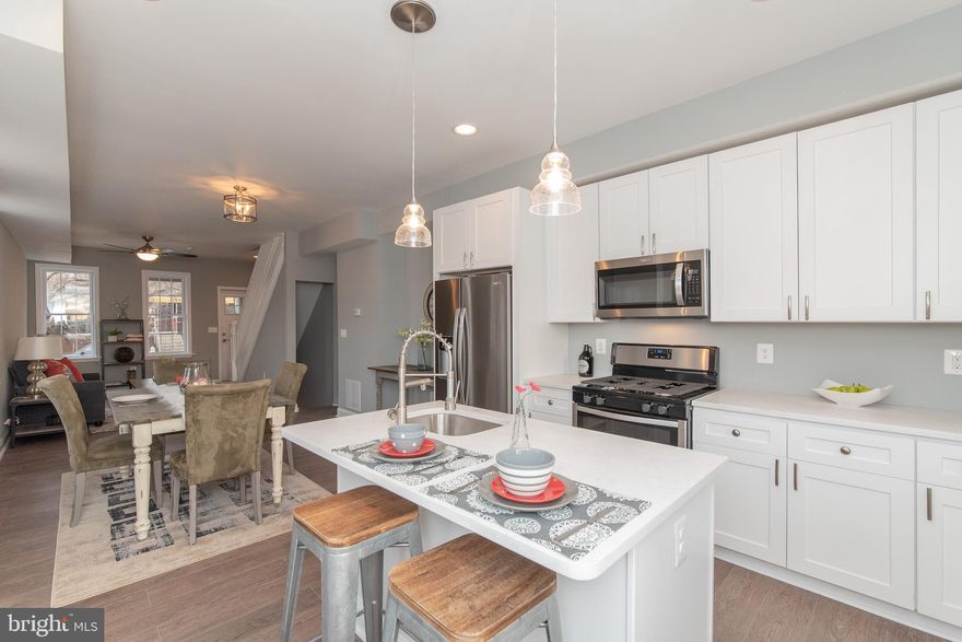 New low price.  Great opportunity to own this beautiful renovated end of group home with all the bells and whistles to make it your own or as an investment property.  New additional upgrades since last listed.  Fully renovated 3 Bed, 3 bath w/master bath suite in the center of the newly constructed Ryan TH Community.  End of Unit Row Home features grand kitchen w/quartz center island, open floor plan with gorgeous natural light with so many windows, fully finished basement with bedroom, egress window, and its own entrance.  All new hardwood floors on two upper levels, new bathrooms, recessed, lighting, ceiling fans, 5 panel doors, new plumbing, new electric, HVAC, duct work, new water heater, new electric, new drywall.  Backyard make it your patio or make it your parking pad, front porch and back porch.  Minutes from bus stops, restaurants, and many hospitals.