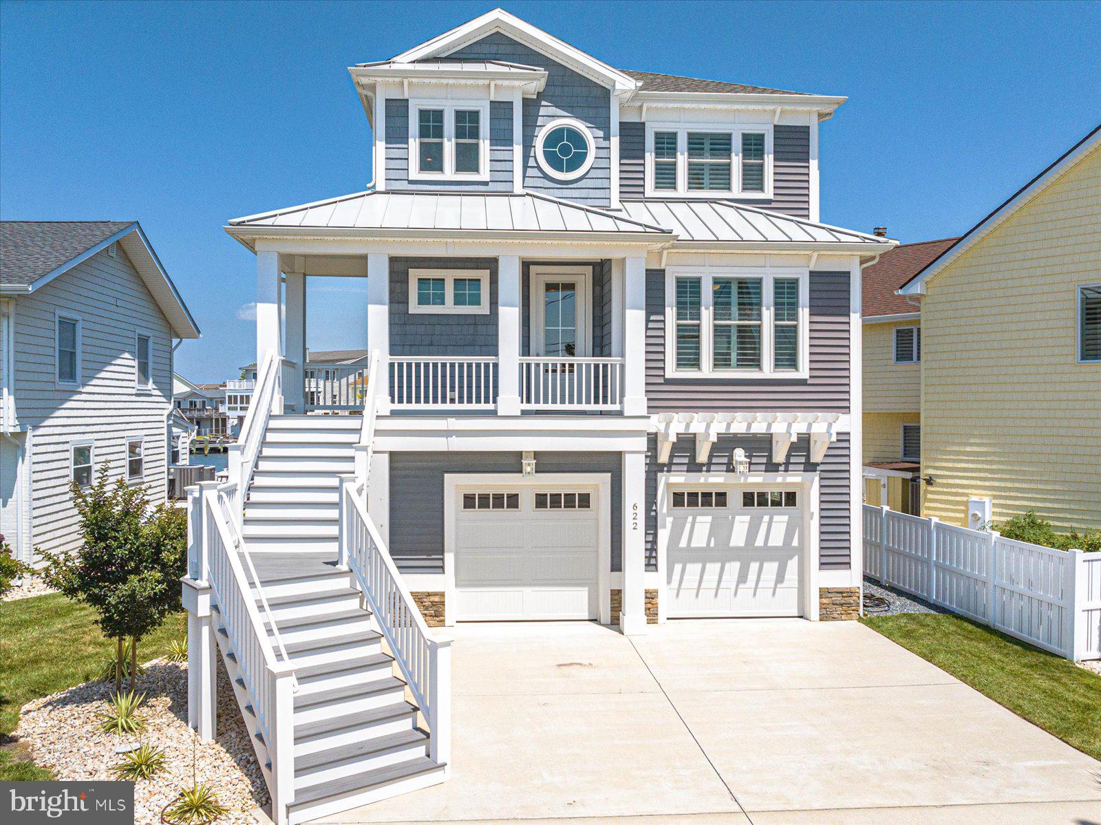 MOTIVATED SELLER! Bring all offers! Have you been searching for your dream home in the town of Ocean City? Look no further than 622 N Pacific! Located in the desirable midtown community of Little Salisbury, this home embodies the epitome of coastal living. With a private dock with two slips, one containing a 20,000 lb lift, there’s plenty of space for your boat, jet skis, paddleboards, kayaks and more. The location offers quick access to the bay plus a secluded setting away from Coastal Hwy while still allowing for the convenience and allure of living in town close to the beach, restaurants, entertainment and more. This three bedroom, two and a half bath home was thoughtfully designed and built in 2017. Everywhere you stand inside the home provides views to outside and the upgrades inside truly separate it from the rest. From the moment you enter into the two-story foyer, you can see that the property has been meticulously maintained and looks brand new. At the entry, you will find a bonus space that can be used as a den, office or a potential 4th bedroom, with pocket sliding doors for the option of privacy. As you walk down the hall to the main living area, you will pass the main floor powder room, a coat closet for extra storage and access to the elevator. There is also a full size laundry room with access to the garage below. As you enter the open space of the living room, dining area and kitchen, you’ll be captivated by the tranquil water views. The kitchen is equipped with all GE Profile appliances, custom soft-close cabinetry and granite countertops. Storage is never lacking with a huge walk-in pantry. The peninsula with bar top seating and the large 8 seat dining table allows for plenty of opportunities to host and entertain. Let’s not forget the extra room outside, with another dining table on the second level deck, which provides incredible views out to the bay. Upstairs, you will find two oversized guest bedrooms, a full bath and the amazing master suite. The master is an owner’s oasis, containing a walk-in closet and the en-suite bathroom of your dreams, with two separate private toilets, dual vanities with a ton of storage, a large built-in soaking tub and a huge tiled walk-in shower. The master suite also provides access to your own private balcony, to sit and enjoy the sunsets every evening over the water. The attentiveness to detail when building the home really shows throughout. The commercial grade plank flooring, recessed lighting, solid core doors, higher ceilings, insulated interior walls and plantation shutters on windows that can withstand 150 mph winds are just a few features that will make you fall in love. Additionally, the home contains a tankless hot water system and a two system Carrier Infinity Series that humidifies automatically and constantly changes the air throughout the home. This home has been set up for any owner to have as little maintenance on the property as possible, with vinyl siding, vinyl bulkhead, automatic watering of the landscape and Trex decking. The oversized garage contains plenty of storage and could even be customized to accommodate extra living space. This is one you won’t want to miss out on seeing! Schedule your private showing today before it’s gone!