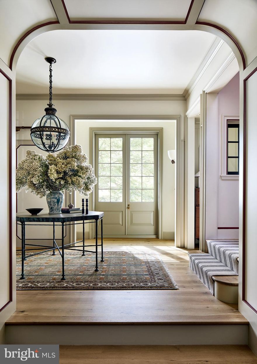 This stunning, fully custom home, built in 2023 by Zantzinger with architectural design by Thomson & Cooke and interior design by Cameron Ruppert Interiors, exemplifies the pinnacle of luxury living. The property, consisting of two separately deeded lots totaling over half an acre in a quiet Bethesda, Maryland cul-de-sac, just moments from the DC line, offers a harmonious blend of sophisticated design and modern comforts.
The residence boasts five generously appointed bedrooms, five full bathrooms, and three powder rooms, all showcasing exceptional craftsmanship. From the beautiful 7-inch-wide character-grade White Oak floors to the Forbes & Lomax light switches and push-out casement windows with unlacquered brass hardware, every detail has been meticulously curated. Custom millwork throughout the home adds an elevated touch, complemented by designer wallpaper and luxurious finishes.
The welcoming entryway features stone slab flooring and two spacious coat closets. The chef’s kitchen is a masterpiece, outfitted with a La Canche range, Sub-Zero Designer Series refrigeration, a Bosch dishwasher, and a striking walnut island with marble counters throughout. Two walk-in pantries with butcher block countertops enhance both functionality and beauty.
Adjacent to the dining room, an elegant bar area features custom tile floors, soapstone countertops, a Sub-Zero ice machine, a beverage fridge, and a stone sink—an ideal setup for entertaining. The versatile office or formal living area features a wood-burning fireplace with a custom stone surround, adding a touch of warmth and sophistication. The family room boasts an expansive and inviting design, highlighted by 18-foot-wide accordion windows, elegant custom lacquered ceilings, and tall French doors that open to a covered porch. This outdoor area includes an additional fireplace and a dedicated gravel dining area. Both fireplaces are prepped with gas lines, allowing for a seamless conversion to gas functionality.
The home is further enriched by a geothermal heating and cooling system, ensuring energy efficiency with minimal environmental impact. The mudroom includes antique terracotta tiles, built-in locker cabinets, and a custom wood-paneled interior Dutch door.
The neighboring lot offers endless opportunities for the future owner. Whether you envision adding a garage, garden shed, or pool, the possibilities are vast, making this property a truly private and one-of-a-kind acquisition.
Luxurious and meticulously designed, this home combines timeless elegance with cutting-edge sustainability, delivering the finest in contemporary living.