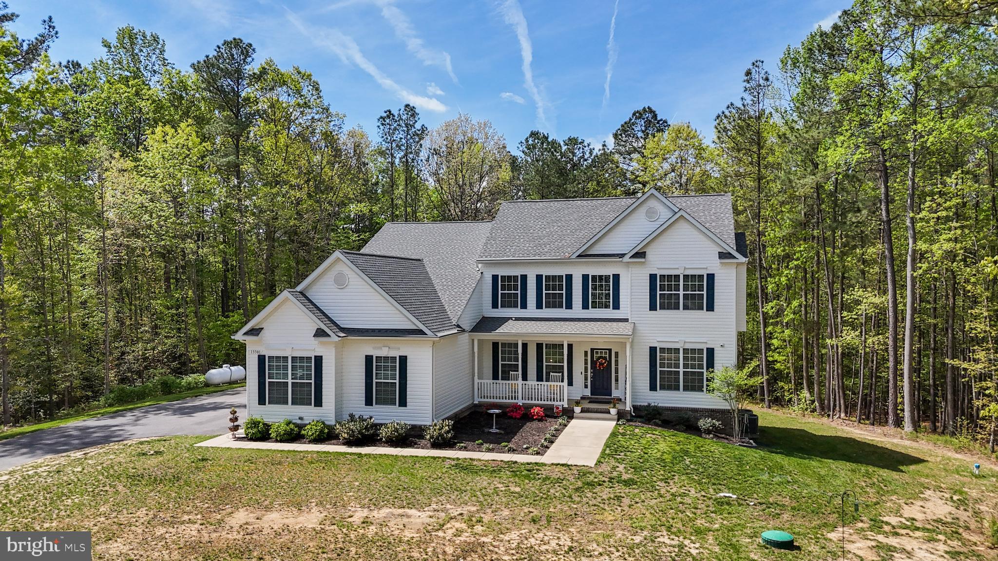 Welcome Home to 13301 Windjammer Court!
This stately colonial, nestled on a 1.88-acre lot with beautiful wooded views, offers the perfect blend of privacy, space, and luxury living. Tucked away on an extended private driveway, you’ll enjoy peace, seclusion, surrounded by wooded views.
Boasting over 4,000 square feet above grade and an additional 2,238 square feet in the walk-out basement to be finished to your liking, this home provides all the space you need to live, work, and entertain in style.
Greeted by a charming colonial front porch, you'll step into a thoughtfully designed home featuring five spacious bedrooms, 4.5 bathrooms, and a three-car garage. Throughout the home, you’ll find upgraded luxury vinyl plank flooring—stylish, durable, and easy to maintain.
The open-concept main level includes a formal dining room, a welcoming great room with a cozy gas fireplace, and a dream kitchen outfitted with quartz countertops, double wall ovens, a gas-ready range hookup, an oversized island with bar seating, a walk-in pantry, and a bright morning room perfect for soaking in the sunshine and taking in the tranquil wooded surroundings.
The main-level bedroom suite offers convenience and comfort, with its own walk-in closet and full private bath—perfect for guests or multi-generational living.
Upstairs, escape to the massive owner’s suite, complete with a dream walk-in closet and a luxurious en-suite bath featuring double vanities, a soaking tub, separate shower, vanity counter, and a private water closet. Three additional bedrooms complete the upper level—two with private baths, and one with shared access.
No shortage of hot water here —this home is equipped with a tankless water heater to comfortably serve all 4.5 bathrooms. A spacious upstairs laundry room adds everyday convenience and functionality. Additionally these is another full laundry room with hook ups on the main level, again lending to the possibility of multigenerational living.
The walk-out basement offers an additional 2,238 square feet ready for your vision, with a full bath rough-in already in place. Whether you dream of a home theater, gym, guest suite, or rec room, this space is ready to become whatever your family needs.
Don’t miss this incredible opportunity to own a truly special home on a private 1.88-acre wooded lot in Hughesville, complete with high-end finishes and modern upgrades throughout.