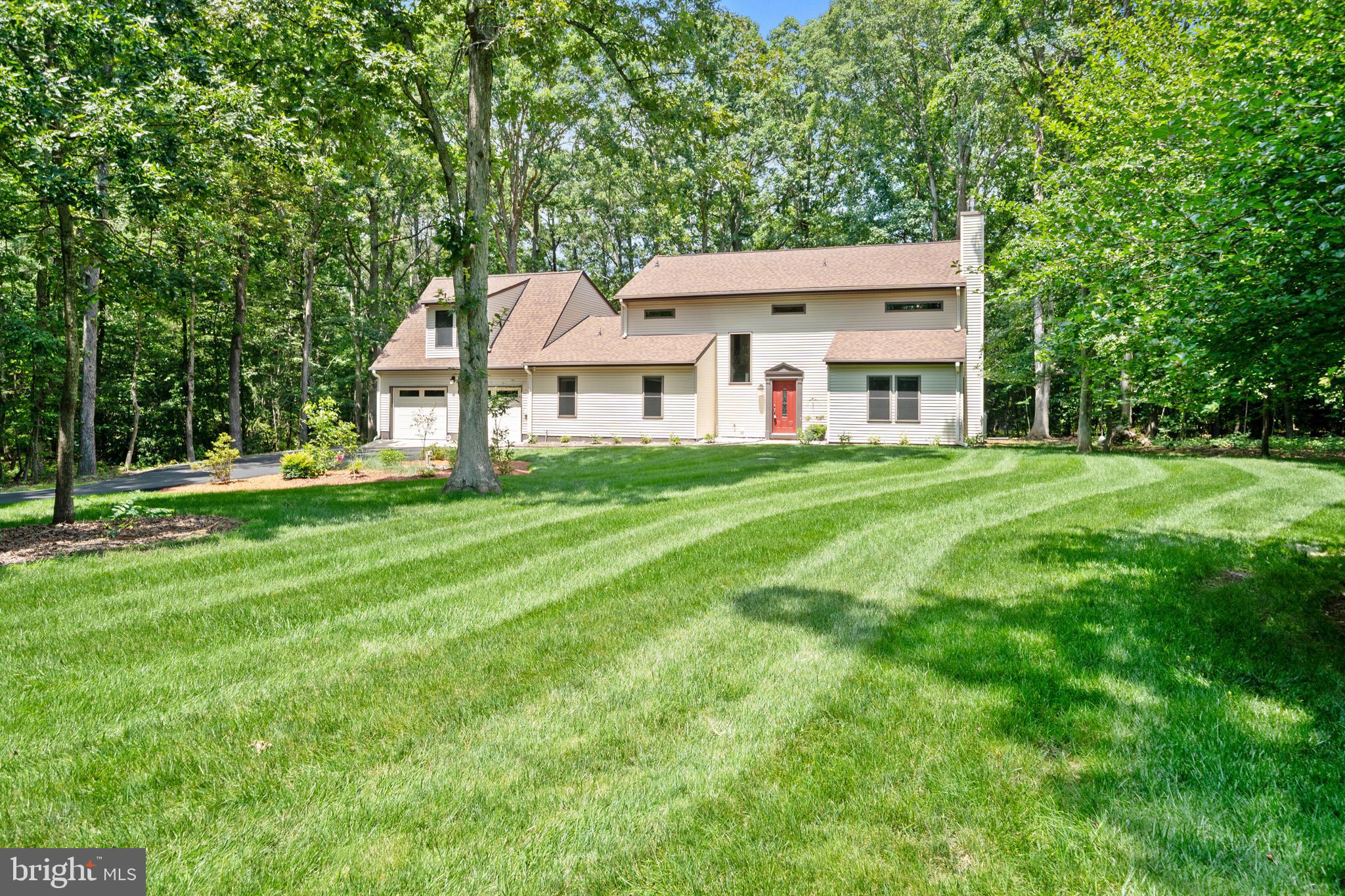 This is the story of a charming home in Wildewood's premier neighborhood. Situated on a 1.21 acre lot on a peaceful cul-de-sac, with a lush green lawn dappled with shade trees, where the scenery is beautiful all year round. Gorgeous hardscape patio out back with a stone fire pit, complete with a seasoned woodpile, is ideal for outdoor gatherings. A large 2-car garage includes a utility room/workshop. An Amish-built 12'x24' shed was installed on the property just last year; with carefully selected color scheme and windows, the shed nicely complements the property. This home is 3,234 sf of finished space, entirely above-grade, offering plenty of flexible spaces, adaptable to your lifestyle. The main level features a living room with gas FP, adjacent to a formal dining room, most recently as a home office. The kitchen is truly the heart of the home, featuring granite counters, stainless steel appliances, a spacious island, induction cooktop, double wall-oven, garden window overlooking the patio, and an adjoining casual dining area/breakfast room. A large study with attached full bath completes the main floor; this space could be used as a first floor primary suite. A first floor laundry room is just down the hall, next to the garage entry. The home's second floor has four spacious bedrooms, each with a walk-in closet. The primary bedroom features an en suite bath, and interior access to an adjacent bedroom, ideal as a nursery or dressing room if desired. A second laundry hookup is located in a hall closet. Accessed by a separate staircase is a 22x24 finished room over the garage, complete with a home theater system/projection TV, and walk-in storage closet. This versatile space may be ideal as a game room, an additional bedroom, or home office. Newer roof, 2022. New water heater, 2025. Wildewood's Neighborhood One enjoys its own community recreation space, featuring a recently resurfaced lighted double-tennis court, shady playground, small pond with walking trails, and a private community building. Available membership to the Wildewood pool complex is also an option. Don't miss the opportunity to make this traditional home and its storybook setting your next chapter!