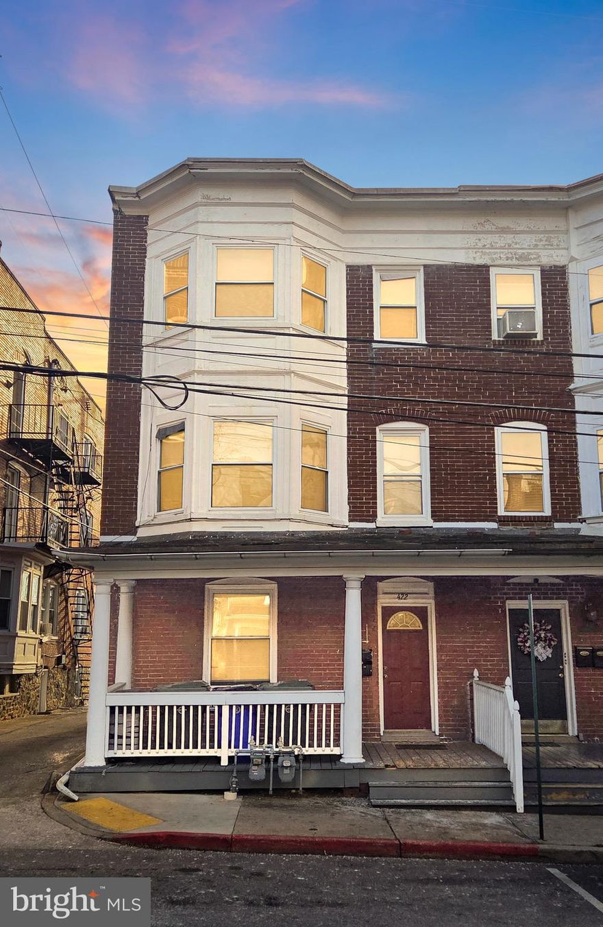 COMING SOON! 2 UNITS : Main Level 1 bedroom 1 Full Bath | Upper 2 levels boast 3 Bedrooms 1 full bathroom , full kitchen and living room space! Built in 1910, this end-of-row townhouse showcases classic Colonial architecture, offering both charm and durability with its solid brick construction. Spanning 2,580 finished square feet, the layout is designed to maximize space and functionality. The interior features a breakfast area, ideal for creating a welcoming atmosphere that can attract quality tenants. The property's configuration allows for flexible living arrangements, making it suitable for various rental strategies, whether long-term leases or short-term rentals. The outdoor space includes a deck, providing an appealing area for tenants to enjoy, which can enhance rental desirability and potentially justify higher rental rates. The lot size of 0.06 acres ensures manageable maintenance while still offering outdoor space for tenants. Parking is a key consideration for many renters, and this property includes assigned on-street parking, adding to its convenience and appeal. The absence of a pool reduces maintenance costs, allowing for a more straightforward management approach. Investors will appreciate the potential for value appreciation in this established neighborhood. The property's age and architectural style may also attract buyers looking for character and history, which can be leveraged in marketing strategies. With no association fees or amenities to manage, this property offers a straightforward investment with lower overhead costs. The lack of extensive renovations needed allows for immediate rental income potential, making it an attractive option for both seasoned investors and those new to the market. Overall, this Hagerstown townhouse is positioned to deliver solid returns through rental income and long-term appreciation, making it a strategic addition to any real estate portfolio.