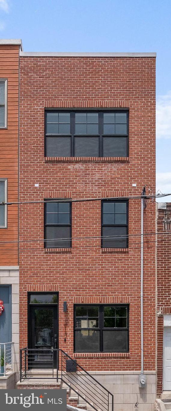 This residence redefines urban living at an incredible price, boasting a gorgeous red brick with stone capping facade, oversized windows allowing an abundance of natural light, a roof deck with city views, as well as superior design and finishes that compare to homes that are double the price! This home delivers an open concept living space with very high ceilings as soon as you walk in. The heart of the home is the large kitchen which features gorgeous shaker cabinets and GE Cafe appliances and stunning quartz tops. Boasting 4 graciously sized bedrooms and 3 beautiful bathrooms, this home provides ample space for both relaxation and entertainment. The Second floor features two graciously sized bedrooms, laundry and a beautifully tiled bathroom. The third floor primary suite is a true sanctuary, offering a spa-like full bathroom that invites you to unwind in comfort and space. It also features a wet bar allowing you to entertain efficiently at your roof top deck. If quality is a top priority for you, this home is the epitome of excellence. Every detail has been carefully curated and comes with a comprehensive 1-year builder warranty and ten year tax abatement. The design and finish selections curated specifically for this home and every detail shows incredibly well. Now is chance to own an amazing home on a great block - schedule your tour today! SqFt includes above and below grade. Taxes are not $1. Taxes and square footage are the responsibility of the buyer to have verified independently. The PAR Standard Agreement of Sale for New Construction of sale must be used for new construction properties whether completed or not.