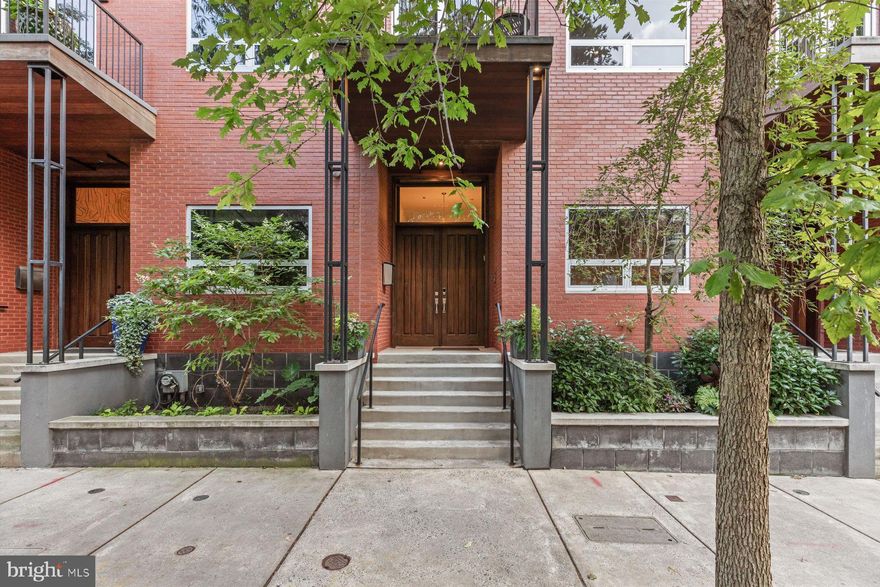 Situated on a bucolic, tree-lined street, this exceptional townhome residence has it all: Airy, dramatic interiors with an elevator to all floors. Two-car garage and two additional parking spots. Three outdoor spaces including one with phenomenal Center City views. This 4,341-square-foot, 4-bedroom/3.5-bath residence on a picturesque block is everything you need for comfortable city living. A double front entrance door flanked by built-in planters opens to a main living level with a dramatic two-story ceiling height. The chef’s kitchen with island seating and a full complement of Wolf/Sub-Zero/Bosch appliances has a walk-in pantry, just one of many well-designed storage spaces throughout this home. The kitchen is open to a seating area where a floor-to-ceiling, two-sided stone fireplace serves as a focal point. French doors on each side of the fireplace open to a roomy deck where you can enjoy the fireplace, plenty of space for dining, a grill with gas connection, outdoor speakers and planters with irrigation. There’s also a home office/bedroom on this level with custom built-in desk and storage. The adjacent powder room is already plumbed for a shower and can return to being a full bath. On the next level is a phenomenal, expansive living room with built-ins, a picture window, balcony perfect for enjoying a treetop view, and a walk-in closet with built-ins. The fourth level has another big gathering space with a wall of windows, wet bar with wine cooler and more storage. This area is just perfect as a family room, gaming/home theater space, playroom…there are so many ways to enjoy it. This floor also has two good-sized en suite bedrooms each with well-designed closets and recently updated bathrooms. There’s also a full-sized laundry room on this floor. The enviable owner’s suite, on the top floor, is where you’ll find sleeping quarters with a private balcony with stunning skyline views, so lovely for morning coffee or winding down in the evening. The dressing area is lined on three walls with built-ins and even has a television and wine cooler. In the main suite bath a steam shower with bench and a jetted soaking tub, two vanities, a custom storage/display area and toilet room complete this floor. The ground level is where you’ll find a fitness room, mechanicals, storage and the two-car garage with tool storage and cabinetry. Outside the garage are two additional parking spaces, and this residents-only area is gated. Walls perfect for showcasing art. Wood floors throughout. Custom lighting. Whole-house audio. Three-zone heating and air conditioning. So many extras are waiting for you at this move-in-ready townhouse, plus it has the benefit of a great location convenient to Greenfield elementary school, Schuylkill River Trail, Giant supermarket, Trader Joe’s and Whole Foods, Fairmount Park, the Franklin Institute and the city’s world-class museums. Schedule a tour and see why this is one of the best buying opportunities now on the market in Philadelphia.