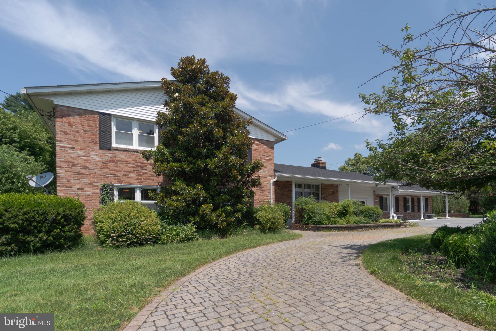 A Unique High light of this house is In - law suite or Home base business Office suite.
3 + 2.5 on Main building, 3+1. on in law suite.
Welcome to 610 Valley Brook Drive, a well-maintained and thoughtfully updated split-level home set on a large, landscaped lot in a convenient Silver Spring location. With multiple living areas, modern kitchen updates, and a fully equipped in-law suite, this home offers space and flexibility for a variety of living arrangements.
Inside, hardwood floors run throughout the main levels, creating a warm and cohesive feel. The entry level features an open-concept family room and kitchen, ideal for entertaining or daily living. The kitchen is equipped with a large stainless steel refrigerator, five-burner gas cooktop, Bosch dishwasher, and KitchenAid wall oven and microwave. Sleek black quartz countertops, a peninsula for seating, under-cabinet lighting, and plenty of storage complete this functional and stylish space. Both the kitchen and separate dining room open directly onto the back patio, making outdoor dining easy.
Upstairs, you’ll find a huge living room with a custom floor-to-ceiling concrete fireplace feature wall—a must-see statement piece. Just upstairs from that are the private bedroom quarters, including two updated full bathrooms. The primary suite features a walk-in shower with a bench, rainfall showerhead, and separate hand sprayer. The guest bath offers a tub/shower combo, double vanities, and a skylight for added natural light.
A standout feature is the connected in-law suite, complete with a full kitchen, two bedrooms, one bath, its own laundry, and a separate entrance that opens to the beautifully matured yard—perfect for multigenerational living, extended guests, or rental potential.
Outside, the large lot is filled with mature landscaping, including willow trees, Japanese maples, and other ornamental plantings. There’s plenty of grass for play, a fenced-in area ideal for pets or children, and ample parking for residents and visitors.
Located just minutes from the Glenmont Metro, Wheaton Regional Park, MLK Jr. Recreational Park, FDA, and major routes like I-495, Route 29, and MD 200, this home offers a blend of peaceful surroundings and commuter convenience.