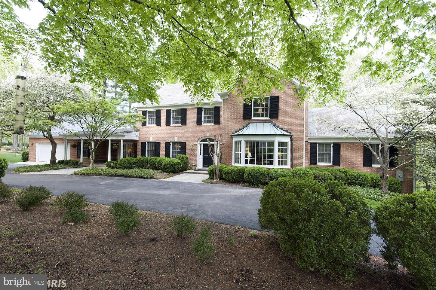 Potomac Falls beauty! Gorgeous 2 acre lot w/pool, four car garage, and spacious great room addition with cathedral veiling and fireplace open to gourmet kitchen. Features main level Owner's suite plus 4 bedrooms upstairs w/renovated baths (2011). Light filled, walk-out lower level with access to the heated pool and yard. Other amenities cir driveway, 4 fpl, Pella windows & more!