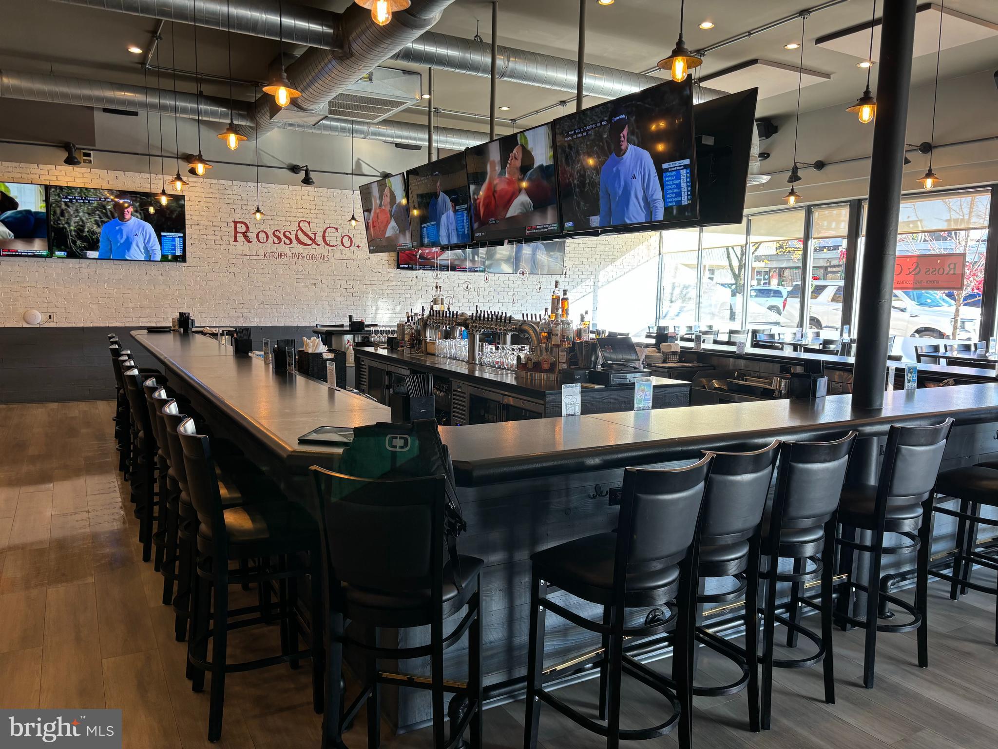 Incredible opportunity to own a fully operational, turnkey restaurant and event space with an R liquor license and occupancy for 289. Spanning 8,000 sq. ft. on the main level and extensively renovated in 2024, this business includes a full-service kitchen, multiple dining areas, two private function rooms, a loft lounge, and a large central bar. The updated interior features new furniture, flooring, lighting, audio/video systems, draft beer/wine systems, HVAC, and outdoor seating.
The main bar area (60’ x 60’) includes 40 bar stools, 40 beer taps, 8 wine taps, 12 TVs, and dining for 64. The main dining room (23’ x 33’) seats 60. A stylish loft (33’ x 34’) offers additional seating for 32 and includes a private office. Two function rooms accommodate 80 and 40 guests respectively—one with a full bar and the other with projection equipment. Outdoor patio dining (90’ x 8’) seats 28. Host area includes a desk and lounge with leather furniture.
The commercial kitchen (38’ x 25’) is equipped with a 10-burner range, 3 double fryers, salamander, broiler, flat top, brick pizza oven, leased double dishwasher, grease system, 8 refrigeration units, ice machine, and Ansul system. TOAST POS system includes 4 monitors, 12 handhelds, and 4 kitchen display units.
Basement level features a second full kitchen (38’ x 25’), walk-in cooler (15’ x 8’), beer cooler (10’ x 20’), 4 freezer boxes, 2 upright freezers, additional storage rooms, office, workshop, ice machine, employee restroom, and utility systems (CO2/nitrogen, water softener, 2 Pepsi BIB towers, 20 metro shelves).
Recent 2024 updates include: new flooring, furniture, bar, kitchen equipment, HVAC unit, audio/video, draft systems, restrooms, walls, and exterior dining. Approximately 9 years remain on the lease with options to extend. Truly turnkey and ready for business.
This is for the Sale of the Ross and Co. Business Only, and the Liquor License. The Sale of the Building is not Included. This is an operating Business. Do not talk to Staff or Managers.