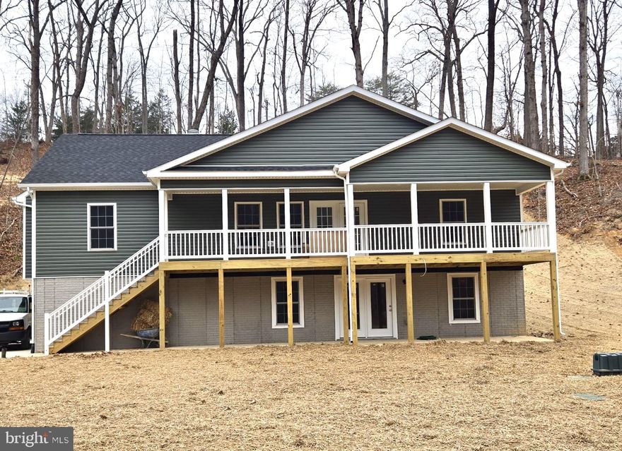 NEW CONSTRUCTION.   Home is able to be permitted for a air B&B through the county. 3 beds 2 full baths. 4 bedroom conditional 6 person septic. 2 car garage in the basement. unfinished basement with full bath rough in. If finished basement is desired for additional $40,000. builder will complete a fourth bedroom with a full bath and a rec room adding an additional 920 sqft. home has concrete driveway. Home is located in Shenandoah Farms which has lake access and two private boat landings for river access.  PICTURES are similar to