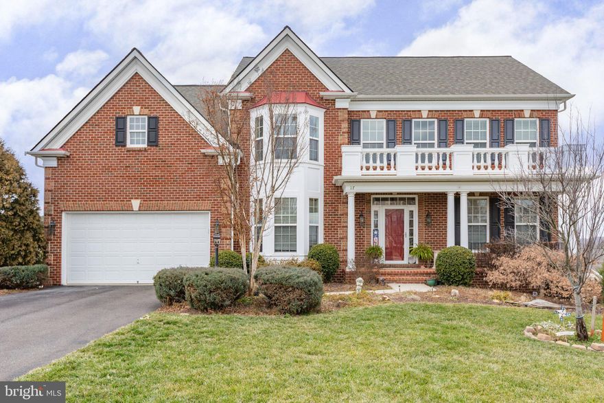 This gorgeous brick front home is located in the sought after Hills of Aquia right off of Route 1 and I-95.  The floor plan is absolutely amazing with four spacious bedrooms all connecting to a bathroom.  Office with bay window and double entry doors just inside the two story foyer with curved wood staircase, formal living room, dining room with box tray ceiling and shadow boxing, family room with cozy fireplace,  large open gourmet kitchen, and breakfast area.  Lower level includes a recreation room with wet bar rough in,  full bath, a rough in media room and 5th bedroom, plus a spacious storage room. New carpeting throughout.  Outside you have a front brick porch, trex decking, stamped concrete patio, fenced in rear yard and irrigation.  Located on a cul-de-sac.  You will find plenty of room to move about, relax and entertain in and outside of this gorgeous home.  Don't miss your chance to make this your forever home.