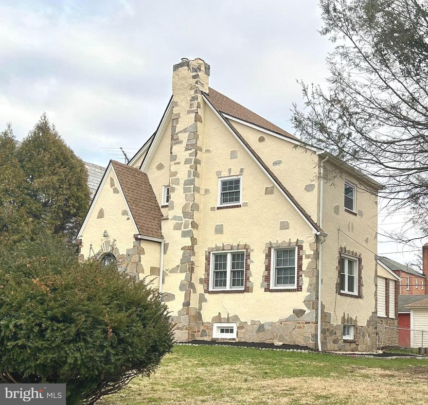 Welcome to 3405 Dennlyn Road, in beautiful Baltimore Maryland! This home is located in the Baltimore City, MD Historic District and is situated in the charming community of Ashburton, This totally attractive, Tudor Style home, has recently been updated.  Enjoy the historic feel of a 1930's city home, with all of today's trending appointments inside.   This lovely home features brand new windows, two original fireplaces, two flex rooms in the lower level, a finished lower level family room, gas heat, CAC, brand new flooring, arched entryways, formal dining room, granite counter tops, ceramic bath tile surrounds, 6 burner (gas) Dacor stainless steel stove, other stainless steel appliances, dual coat closets in the foyer, beautiful hardwood staircases, owners bedroom with private bath, recessed lighting, new roof, 1 car garage, an outbuilding that would lend well to an outdoor mancave or she shed with brick tile flooring, flagstone flower beds welcome you in the driveway, digital locks, security system, enclosed rear porch , cedar walk in closet in the attic level bedroom and the list goes on!  Minutes from the Inner Harbor, Ravens Stadium, Camden Yards, downtown restaurants, shopping and convenient to I-83.  Pack your bags and move right in!