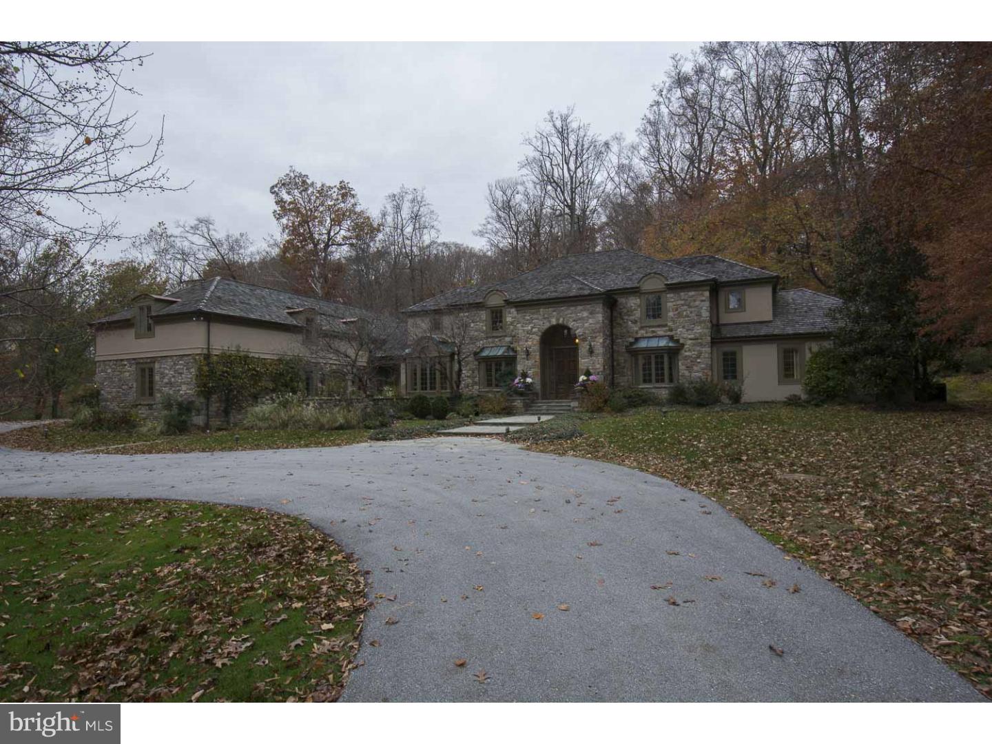 Positioned on a private street and off a long drive in the heart of Radnor township, find this elegant European styled estate home tucked on 6.5 open, wooded and conserved acres offering unparalleded solitude within a premium neighborhood setting The classic exterior is complimented by a modern floor plan with sweeping staircase, a two story foyer, and step down volume ceiling living room with fireplace and two sets of French doors which lead to the deep full length rear terrace and hot tub. The formal dining room with gleaming hardwood floors, intricate crown moldings and bay window enjoys an eastern exposure, while the breakfast room/solarium provides a beautiful retreat space for informal dining or as an additional home office. All white gourmet kitchen with generous cabinet space, granite counters, center island, gas cook top, stainless steel appliances and double wall ovens connects seamlessly to the vaulted family room with natural stone surround fireplace. Stunning Master suite with marble bath and generous closets is highlighted with a wood-burning fireplace and exit to the front of the house. Adjacent to the master is another bedroom, ideal as a nursery or as expanded master space. A library, with custom built-ins and paneled cherry wainscoting could also be purposed as an additional first level bedroom as it opens to a full bath. Ascend the front stair to find four family bedrooms and two full baths. Finished lower level offers wine cellar, recreation room with wood burning fireplace and outside entrance. A bonus room, accessed by independent stair case and located over the mudroom/family entrance provides large private office area or "bunk room" A beautifully executed and presented house in a truly idyllic setting