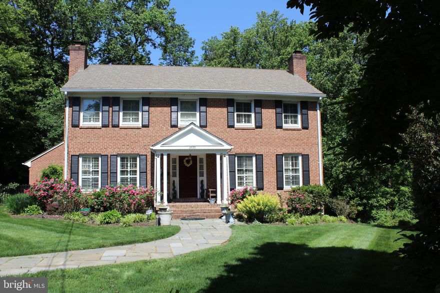 Timeless, elegant red brick colonial in sought-after Bellevue Forest. 5BR/3.5BA with numerous recent updates. The kitchen features lovely Carrera marble countertops, a farm sink and stainless steel appliances adjacent to a breakfast nook. The primary bathroom was completely and smartly reconfigured and includes a double vanity with Ceasarstone countertops, heated floors, an air-jetted soaking tub, new windows, new cabinets, and a 3-way showerhead. Well-maintained hardwood floors and high-end plantation shutters throughout. 4 bedrooms, 2 full baths upstairs. 2 wood-burning fireplaces. Expansive, versatile walk-out lower level features modern LVP floors, updated soapstone hearth, wet bar, bedroom/full bath and ample storage.  Spacious outdoor deck perched atop a 1/2 acre+ lot in a lovely wooded setting overlooking parkland. Oversized 2-car garage. HVAC new in 2024 and washer/dryer about 1 year old. At the end of a quiet cul-de-sac. Great location near Chain Bridge, GW Parkway and Military Road. Convenient to 67-acre Potomac Overlook and other popular parks. Within Donaldson Run swim club boundary. Schools: Jamestown Elementary, Williamsburg Middle, Yorktown High.