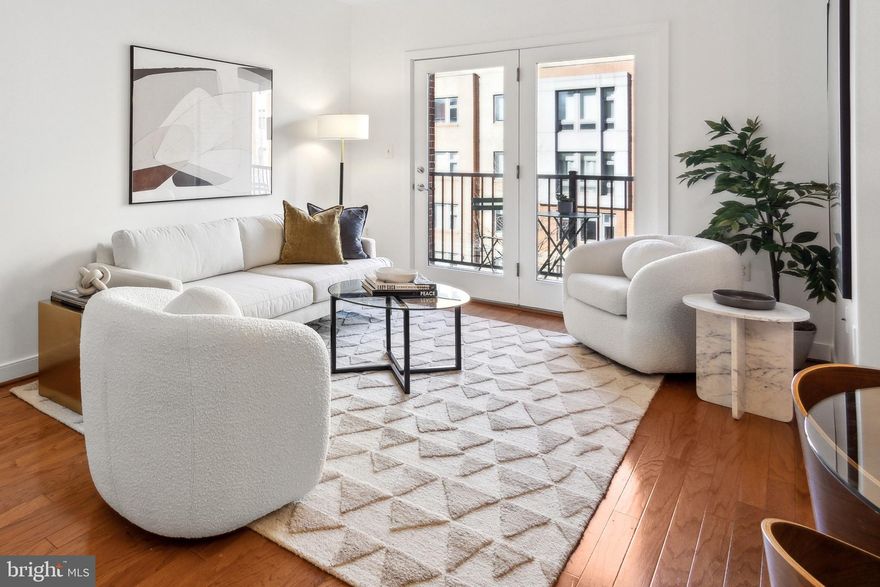 With close proximity to Potomac Yard, Amazon HQ2, National Airport, Virginia Tech NoVA campus and the charming Del Ray neighborhood, The Preston is at the heart of the action. Unit 208 is a large two bedroom, two full bath home with in-unit laundry, outdoor space and two-car garage parking. 

The open plan living / dining area has hardwood floors and opens through a double glass door to a balcony large enough for a cafe table or a comfortable chair. The efficient kitchen surrounds an island with room to seat four, and features stone counters, stainless steel appliances and a ceramic tile floor. 

The large primary bedroom has plenty of room for a king sized bed as well as seating or a home office nook. A big walk-in closet faces a corner with room for large storage furniture, and leads to an ensuite bath with a tub shower and a bonus linen closet. The second bedroom is also large enough for a king sized bed and has a deep closet and big windows. It shares a second full bath with a step in shower and tile floor. 

The Preston Condominium is a 53 unit development with a fitness center, community room, mail room, lobby lounge, roof terrace and courtyard. The garage, four floors and roof are served by two elevators and has an on-site management office. Unit 208 has two assigned garage parking spaces and a supplemental storage locker.

Walk to amenities that include Potomac Yard shopping (0.2 mi.), Metro (0.5 mi), VA Tech NoVA campus (0.2 mi), and the charming Del Ray dining/shopping neighborhood (1.0 mi). Hop on the metro to Amazon HQ2 (1 stop) or Old Town Alexandria (2 stops) or utilize the convenient bus system with stops less than a block away.

A monthly condo fee is $722.00 and includes parking, storage, fitness center, community amenities, on-site management, water, insurance and more.