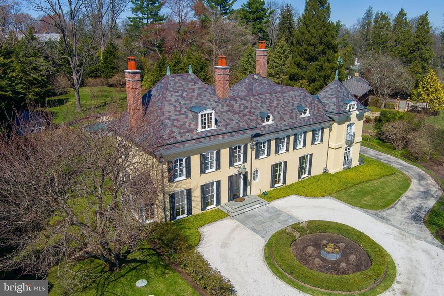 This French Country residence sits majestically on a gently rising, superior 1.5 acre lot in one of the best neighborhoods in northside Villanova on a walkable cul-de-sac.   An executive retreat featuring approximately 9000 square feet of exquisite living space which  was originally designed by the renowned architect, Walter K. Durham. The architectural goal of the 2018 renovation was to preserve and enhance the original dramatic "Durham" design elements, such as floor to ceiling windows to produce a home that is perfect for family living and for gracious entertaining.  An open floor plan, coming in from the courtyard is seen visually  throughout the home to the gorgeous pool area and walled courtyard, creating a melding of interior and exterior spaces. The chef's dream gourmet kitchen opens up to a spacious family room with breathtaking views of the glorious grounds, pool, spa, terraces and pool house. Gracious room sizes with high ceilings, expansive bright windows and a wonderful open flow. The home features 5 en-suite bedrooms, 6 full and 2 half custom baths and a fully finished daylight lower level. The entire landscape was designed by an award winning Landscape Architect. A European gravel entrance circular auto court, rear walled courtyard, an Alee' of "tree form" white hydrangeas, magical English Oak Pyramid street trees, Blue Princess Holly detailing, extensive Belgian block borders and Pennsylvania Blue-stone capped walls. Vermont slate roof, copper down spouts and gutters, extensive exterior molding detail, one of a kind custom crystal and brass detailed railings, and much more.