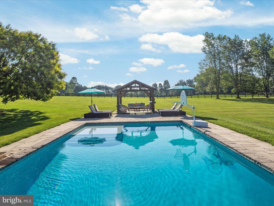 Summertime never looked so good!  Imagine sipping lemonade on the front porch.   Imagine napping under the shade of the pool cabana.  Imagine a enjoying a night cap in the evening sitting in the screened porch.  
<br> <br>
Welcome to a spectacular home that sits on a private, flat  3.4 acre lot with a POOL, pavilion, hot tub, has, NO HOA and Verizon Fios is available.    A screened porch on the side, a deck off the back and a Juliet balcony off the primary suite, allows you multiple ways to overlook your acreage.  You can have it all - whether you are looking for peace and serenity and/or a wonderful place to entertain. 
<br> <br>
The main level has undergone a full renovation to open the floor plan and renovate the kitchen.   The stunning white kitchen cabinets gleam against the slate colored counters and the dark marbled island.  The kitchen over looks the breakfast area and family room with its cozy fireplace.  The formal dining room is extended and brightened by a bay window.   
<br> <br>
The second level has a primary suite complete with a fireplace, primary bath and walk in closet.  The large guest rooms share a renovated hall bath.  The upper level is complete with conveniently located washer and dryer.
<br> <br>
The finished lower level walks out to the hot tub and pool.  It has oversized windows , bedroom, and full bath to make the space functional and bright.