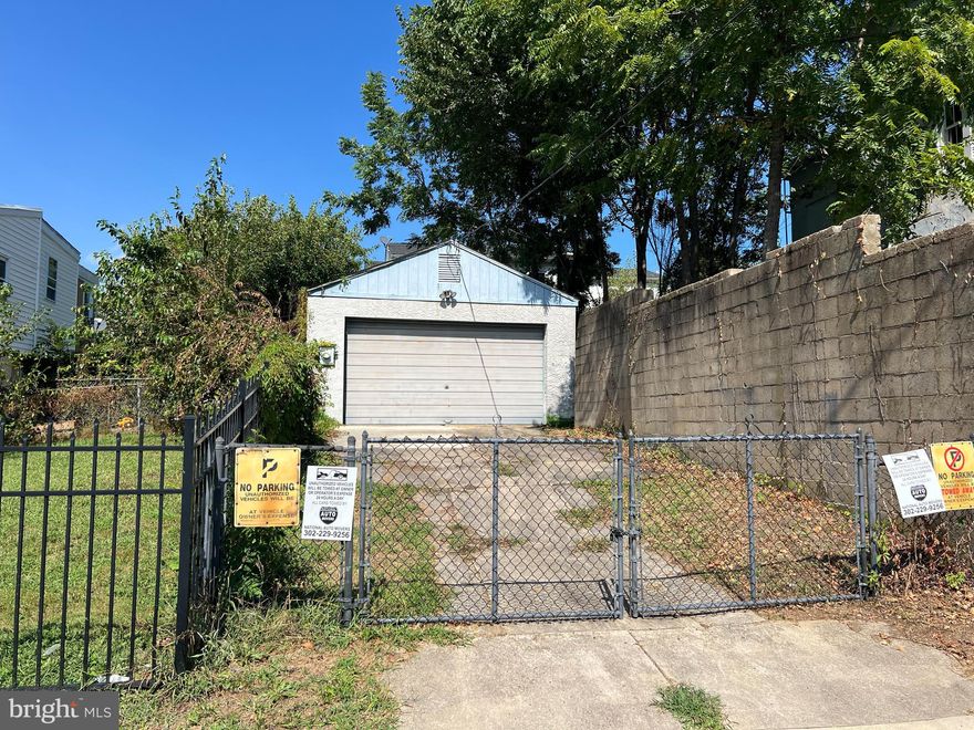 Car collectors and hobbyists, take note! Tucked away on a quiet Wilmington street, this gated 75x19 foot property is the perfect sanctuary for your projects. Featuring a massive block-built garage with concrete floors and a deep layout, there’s room for multiple vehicles plus extra parking on the spacious driveway. The garage is already wired with an electric panel that has room to grow, and we’ve included the storage shelving and an electric door opener to get you started. From business storage to a private workshop, the possibilities here are endless. Come check it out before someone else beats you to it!