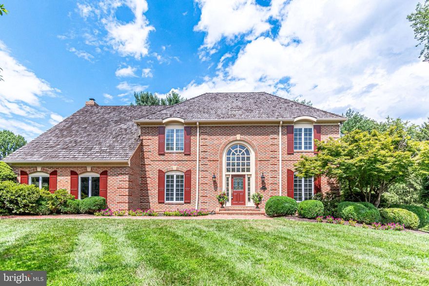 Gorgeous brick colonial situated on quiet cul de sac on  "premier lot" that is nearly an acre.  Brick walkway leads you to this center-hall colonial with 2-story foyer, where custom moldings, palladium window & grand staircase greet you! You're home!  Gorgeous hardwoods throughout main level & upper level hallway.  Open concept, eat-in kitchen features new stainless double-wall ovens, tile backsplash,  42" cabinets, recessed lighting, on-trend pendant lighting over large island with cooktop, tile flooring, pantry & butler's pantry with granite  & tile backsplash. Sunny kitchen with breakfast nook surrounded by bay window OPENS to adjoining great room with brick gas fireplace (can be wood-burning) and mantle.  French doors lead you to expansive sunroom with walls of windows, tile flooring & new ceiling fan.  Separate dining & living rooms with hardwoods, crown molding, chair rail & all freshly painted. All 3 baths are updated with stone counter tops, new mirrors, vanities & lighting.  Master bedroom suite is enormous with sitting areas, walk-in closets, new carpet & lighting ! All bedrooms are quite spacious and with new carpeting & light fixtures.  On-trend new oil-rubbed bronze door knobs throughout.  Laundry on bedroom (upper) level!   Expansive lower level offers full bath, loads of entertainment and living space, new carpet & room to expand!  Cedar shake roof replaced in 2008 (30-year warranty!) Crossfield Elementary, Carson Middle & Oakton High School. Close to shopping, theaters, Wegman's, Whole Foods, Dulles Airport & more!