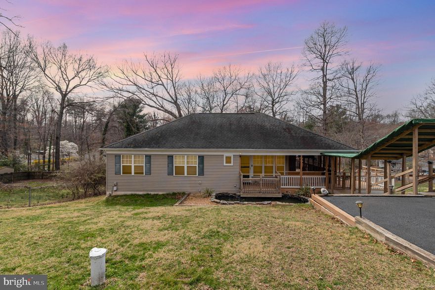 Beautiful spacious rambler on almost half an acre with a main level large primary ensuite bedroom,  kitchen that is open to the family room, multiple decks, seren screened in porch (tv conveys), fence, finished lower level with 3  bedrooms that have full windows so lots of light and a second family room, full bathroom, a wet bar and full walk out, home has a hip roof known for its stability and durability! This home is located less than a mile from the river so within walking distance. 4 wheeler, go carts or golf cars to beach area. Lake access is available for $125 per year.  HVAC 2020, New well pump, system and water line, newer water softener system, Hot water heater 2024 and double layer installation in attic. Sellers are having the whole house painted week of 4/7/25!  Enjoy the main level living in this great location! TV on screened in porch and the swing convey.