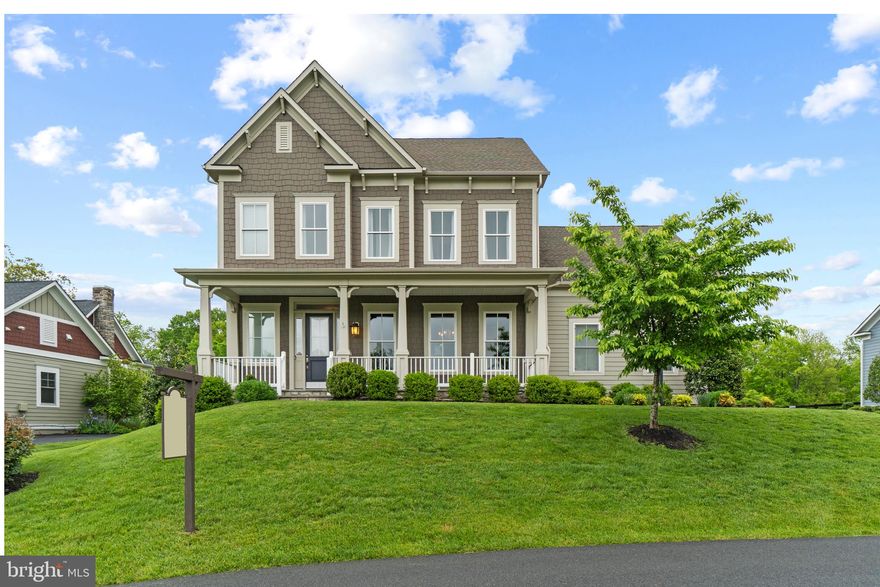 Stunning K-Hovanian Thornton model has it all from top to bottom, located on a premium half acre lot backing to Willowsford conservancy. Sitting on a private loop lane in the community, the expansive slate front porch welcomes you. Upon entering the home, is the formal dining room with crown & shadow box molding. The gourmet, custom kitchen, is the show stopper of the home with quartz countertops, wooden hood vent & floating shelves. Shiplapped walls, built-in storage in the pantry & butlers pantry complete the space. The family room boasts a cozy fireplace off of the kitchen. Behind the kitchen is an office nook with new built-in shelving & mudroom creating the perfect "drop zone". A main level bedroom & full bathroom create the perfect guest or in-law suite with views of the lush green backyard. On the upper level is the primary suite with hardwood flooring, custom wallpaper, built-in's in the closet & views of Tulip Poplar Pond.  Three additional bedrooms, two full bathrooms & laundry room complete this level. The walk-up basement rec room is finished with a wet bar rough-in, full bathroom, large storage/utility room & potential for a 6th bedroom once finished. Sellers have added an additional vent & thermostat for the upper level dual heating & cooling. This home shines, welcome home!