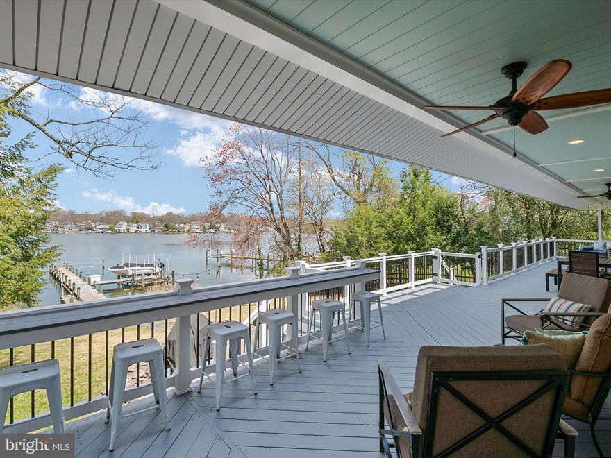 Welcome to 322 North Drive, a waterfront sanctuary nestled along a wide expanse of  the Magothy River in Severna Park, Maryland.  Upon arrival, you'll be immediately captivated by the allure and charm of this expansive, nearly 7,000 square foot residence. Enhanced with an exterior upgrade in 2017 featuring craftsman-style architecture, the home boasts striking curb appeal, characterized by its distinct lines and welcoming porch.

Step inside to discover an interior flooded with natural light, creating an inviting atmosphere. The waterfront living room, complete with a gas fireplace and hardwood floors, offers room for several conversation areas and a large sectional for TV viewing. The kitchen and dining area are a chef's delight, showcasing quartz countertops, custom cabinetry, a farmhouse sink, and high-end stainless steel appliances including a gas stove and double ovens. A convenient beverage refrigerator at the end of the kitchen peninsula adds to the functionality of the space, making it ideal for hosting gatherings or spending quality time with loved ones in a warm and welcoming environment.

Discover the adaptable main level space, ideal for a 4th bedroom, home office, or gym. Convert it into a private in-law or au pair suite with a full bath and space for a kitchenette and laundry.

Indulge in the serenity of the luxurious primary suite, where breathtaking waterfront vistas await. This secluded retreat features a generous layout, a spa-inspired ensuite bathroom, and not one, but two custom walk-in closets. Step outside onto the private waterfront deck, ideal for savoring morning coffee or stargazing under the evening sky. Two additional bedrooms on this level share a convenient Jack and Jill bathroom, with one bedroom boasting picturesque water views. For added convenience, an upper-level laundry room and a spacious cedar closet ensure effortless living.

Descend to the updated lower level where a 2,000 square foot additional living area awaits, complete with a cozy gas fireplace. Perfect for entertaining, this space features a stylish bar with full-size dishwasher, mini fridge, double sink, and quartz counters. Whether you're hosting a cocktail party or enjoying a casual night in by the fireplace, this area provides the perfect setting for socializing and relaxation. Additionally, there's  a 5th bedroom, with a connecting door to a full bath, and a convenient walkout door to the side yard for easy access to outdoor enjoyment.

Whether you're passionate about boating or simply savor the delights of waterfront living, this property caters to maritime enthusiasts of all kinds. Delight in your very own private oasis featuring deep water access, a pier, two lifts, and rip rap along the shoreline. With ample space for a sailboat, you'll relish the freedom to explore the open waters at your leisure. Additionally, the pier offers the convenience of hot and cold water access, enhancing your waterfront experience.

Relax and unwind on the expansive deck overlooking the water, perfect for al fresco dining or soaking in the natural beauty of your surroundings. The deck staircase leads to a stone patio complete with fire pit and white lights strung through oars! A lush lawn, meticulously landscaped gardens and fish pond complete the outdoor oasis, creating a tranquil retreat for outdoor enjoyment.

An oversized 2-car garage awaits, equipped with an EV hookup for modern convenience. A dedicated tool room stands ready for your projects, while a convenient door leads directly to the sideyard, facilitating effortless transitions between indoor and outdoor pursuits. Beyond, a spacious concrete pad awaits your vision, offering potential for a future shed, basketball court, or pickleball court, inviting active living right at your doorstep.

Prime commuting location to Baltimore, Ft Meade/NSA, Annapolis or Washington DC. Schedule your private showing today and make your waterfront dreams a reality.