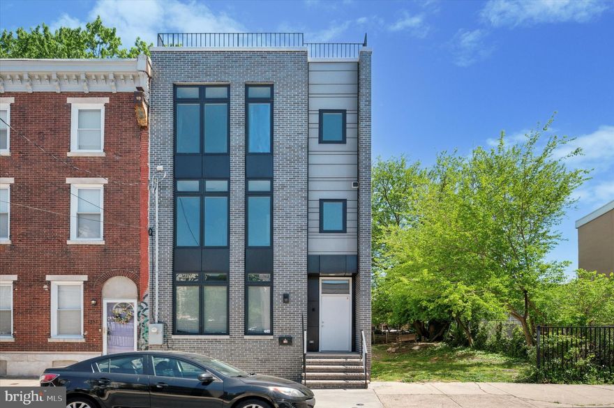 This modern masterpiece is waiting for its next owner! Built in 2019, the 20-foot wide home features a bright and expansive open floor plan featuring wide plank hardwood floors, high ceilings, and tall windows. 

The kitchen is a chef's dream thanks to a large sit-in island—perfect for displaying the most delicious hors d'oeuvres and entertaining—premium countertops, plenty of cabinetry, and a pantry. 

Head to the back of the house to the living area, which promises a space for plenty of memories to be made. From there, glass sliding doors lead to the fenced backyard. With the perfect outdoor living furniture and plants, this will make for the perfect summer escape. 

Walk up the modern open-tread stairs to the second floor, where you'll find a generous en-suite guest bedroom and bathroom with expansive windows and ample closet space. This floor also includes an additional bedroom, a bathroom, and laundry room. 

The third floor is dedicated to the primary suite, including two walk-in closets, a spa-like bathroom, and enough bedroom space to fit a king-size bed. The bathroom is a dream come true with double sinks, a free-standing soaking tub, and shower.

 One more floor up leads to the rooftop deck, featuring stunning skyline views. The home also includes a fully finished basement, which can be used as an additional living space. There is also a bedroom and full bathroom on this level. 

Located in the heart of Old Kensington, the home is in close proximity to Fishtown and Northern Liberties—giving you access to plenty of award-winning restaurants and coffee shops.