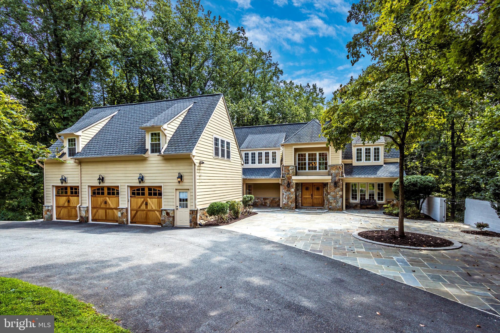 Welcome to this spectacular home, situated on over 2 acres of private wooded lot with tranquil surroundings and scenic views from every room! This happy home offers 6 bedrooms, 7 full and 2 half baths and plenty of room to spread out. It is great for entertainment with a 3-car garage & plenty more spaces to park in the circular driveway. Exquisite detail and materials. Hardwood floors throughout the main and upper floors. Entire house renovation with built up and out in 2008, adding over 3000 sq ft,, public water, sewer, and gas line hookups.
The main floor offers a two-story foyer, formal living room with stone wood burning fireplace, formal dining room, gourmet kitchen with granite countertops, ceramic titles, stainless steel appliances, breakfast room and breakfast bar leading to a screened patio with beautiful woodland views, sitting room and library connected with a double-sided gas fireplace, and mud room with a large walk-in pantry, closet, and laundry room.
The separately heated/cooled upper level includes a master suite, 2 additional large bedrooms with a Jack and Jill, and 4th bedroom with an en-suite bath. An additional half bath is offered on the upper floor.
The lower level offers a large recreation room with a gas fireplace, additional master bedroom with a separate shower and a soaking jetted tub, an additional bedroom, a hallway full bath and a laundry room with a service entry.
BONUS - 1BR suite above garage with private entrance, full bath, kitchenette, abundant storage space, hardwood floors, and separate heating and cooling system can serve as a private office or an in-law suite.
New Telescopic Downdraft System and Refrigerator, double wall ovens are on back order. 1 Year Home Warranty.
Recently completed hardscaping and brick paved side patio are perfect for outdoor activities.
Very close to parks, trails, golf, Ice Center, tennis, restaurants, Potomac Village, and the C&O Canal. Owner is a licensee.