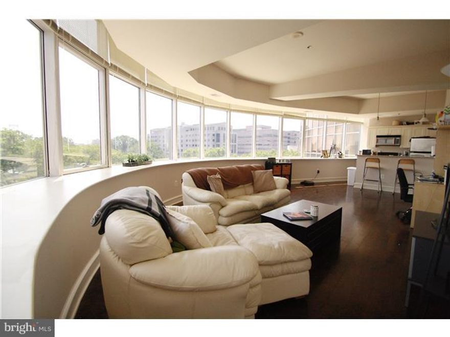 Exclusive Metro Club 1 bedroom, 1 bath condo with secure gated PARKING and 180 degree panoramic city/bridge views. This unit features large windows spanning the entire length of the unit allowing an abundance of natural light. There is an open floor plan with hardwood floors, kitchen including stainless steel appliances and granite counter tops with breakfast bar, marble bathroom, and plenty of storage space. The unit is equipped with central air/heat and in-unit washer/dryer. This unit features a unique layout that is rarely available since there is only one unit per floor that includes the panoramic city and bridge views. Metro Club is a secure building with doorman and features an outdoor pool, fitness center/gym, and newly renovated lobby. Situated in a prime location between Old City and Center City with convenient access to public transportation as well as I-676 & I-95; all overlooking Franklin Park and Ben Franklin Bridge.