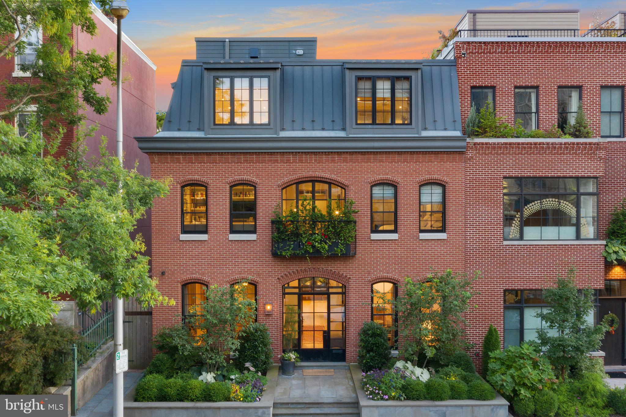 A once in a lifetime opportunity presents itself to own one of the most finely crafted and architectural rich townhomes in Philadelphia. 2322 Green Street is a stunning 34-foot-wide townhouse nestled on a tree-lined and quiet block in Fairmount. Having been constructed just over 3 years ago, this nearly 7,000 square foot urban masterpiece has 5-bedrooms, 5-bathrooms, and a powder room. Enter through a double set of steel and glass doors and a living area and formal dining room await with custom built-ins, exposed wood and steel beams, white oak hardwood floors, over 12-foot ceilings, and an open concept that leads you directly to the rear of the home. There you will find the kitchen outfitted with solid walnut cabinetry, limestone counter-tops, stainless steel appliances, and a second living area and dining nook ideal for the whole family to gather and nestle by the fireplace. Off the living room is a private terrace furnished with beautiful landscaping, a water irrigation system, and an outdoor sound system. The 2nd floor is expansive with extra-wide hallways leading to a double set of doors that open to the master bedroom suite. Outfitted with a wall of custom-built closets, large open and airy windows, and a tasteful balcony to enjoy a morning coffee and breathe of fresh air. The five-fixture bathroom is spacious, exquisitely designed, and functional with all the finishes one could hope for. Down the hall is a laundry room, library, or den space with a Juliet balcony, and 2nd guest bedroom with an en-suite bath. The 3rd floor is set up as a children's wonderland. There are 3-bedrooms and 2-bathrooms all with plenty of closet space and a communal area for everyone to gather and play. The custom-built stairway leads you to the 4th-floor roof deck with views of the city that will take your breath away. The lower level is open to the backyard and is fully finished with a playroom, home office, gym, and storage areas. Additional features of the home include an elevator, four-zone HVAC, storm management system, and up to 3 car parking. Each floor of the home is interconnected with unobstructed views of Center City, the Barnes Foundation, and the Philadelphia Art Museum. around 7 years left on the tax abatement. Now showing privately to only qualified buyers. List of inclusions: All light fixture, consoles, and Lutron light controllers, all chandeliers, all plumbing fixtures, all appliances, all TV brackets, all large planters, all garage storage racks, all shelving units, outdoor audio speakers included List of exclusions: TV and remotes, entrance foyer light fixture, small freestanding planters, Sono system. Furnitures are available in a separate Bill of sale if any interest.