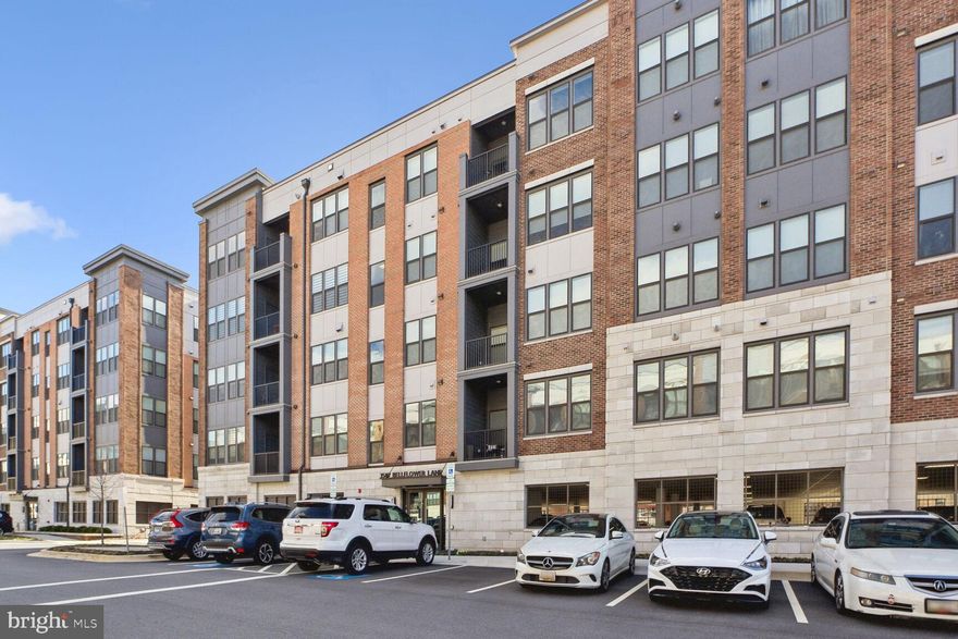 Welcome to The Preserve at Tower Oaks, where luxury meets convenience in the heart of Rockville, MD. This meticulously crafted open layout 2-bedroom with den and 2-bathroom unit, known as The Finn model, offers unparalleled comfort and style. Immerse yourself in modern living with spacious interiors, sleek finishes, and abundant natural light throughout. Each upgrade in the condo has been hand picked with a designer eye including the upgraded flooring, a magnificent island adorned with white Quartz countertops, upgraded stainless steel appliances, and modern kitchen cabinetry. The expansive living and dining area seamlessly connects to the kitchen and offers access to the sunlit balcony. The primary suite features a lavish ensuite bathroom boasting dual vanities and a frameless shower for added luxury. Primary bedroom has a very large walk in closet. Both bedrooms have upgraded carpet. In addition to the two bedrooms, the Finn model comes with a den space perfect for a home office! Parking space conveys with the sale of the unit (space #2). Secured parking below the condominium building is provided. The complex had electric car charging stations. Furthermore, there are many parking spaces accessible in front of the building. The heart of the community, The CORE, offers a well-planned space with a cafe, yoga and fitness facilities, an outdoor pool, and various seating areas. The Preserve at Tower Oaks is incredibly conveniently accessible to Pike & Rose, shopping, dining, and the amenities of the 270 highway.