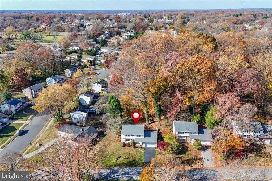 Prime North Wilmington location in the popular community of Brandywood backing to New Castle County parkland, this two-story colonial features newly renovated primary bathroom, beautifully maintained hardwood floors, replacement windows plus updated hall bath. On the main level you’ll find the generously sized living room, formal dining room and kitchen offering warm wood-tone cabinetry and ample countertop prep space. The adjacent main floor family room boasts a wood burning stone fireplace and sliding glass doors leading to the rear flagstone patio overlooking the wooded rear yard that backs to open county land. Perennial flowers fill the rear yard and side path. A convenient guest powder room & interior access to the two-car garage completes this level. Upstairs, the primary suite offers a newly renovated private bath and a fabulous walk-in closet. Three additional well-sized bedrooms share an updated full hall bath. Plenty of storage found in the hall linen closet and walk-in hall attic. The unfinished basement offers excellent space for even more storage, a workshop, or the opportunity to finish for additional living area. Recent updates include, gas furnace (Calvert, 2023) and single-layer roof (2018). A desirable school feeder patters & Convenient North Wilmington location - just minutes from great shopping and dining, walking distance to The neighborhood park/open space (Old Brandywood Elementary) and Jester Park plus easy access to major routes for quick commutes around Wilmington or into nearby Pennsylvania.