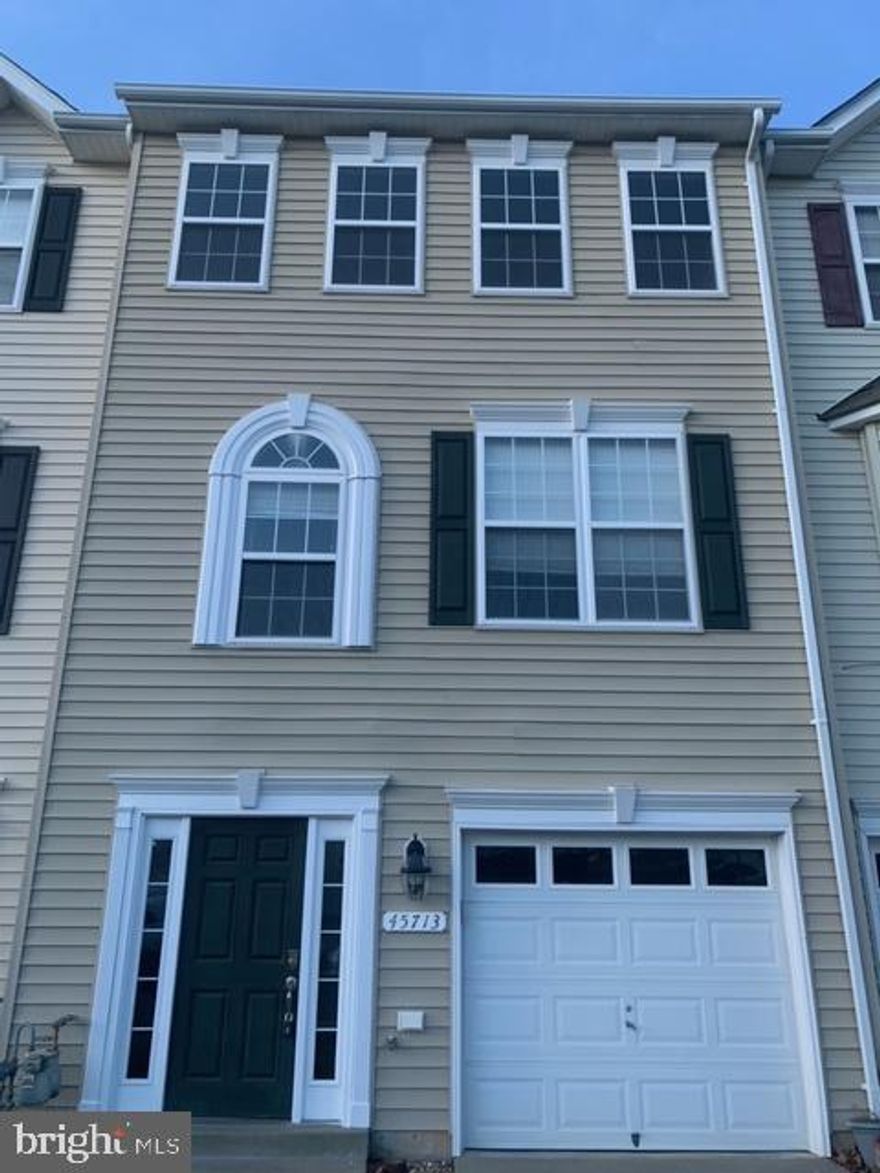 Sprawling across three stories, this exceptional townhouse offers the ultimate in functionality and entertaining! The lower level features a haven for relaxation with a custom bar, refrigerator, and a convenient half bath with washer and dryer. Unwind in this space before stepping out onto the cool concrete patio for a breath of fresh air. Ascend to the second floor, where your inner chef will be delighted by the stylish kitchen with an eat-in area. Host formal dinners in the dedicated dining room, then unwind in the cozy family room. Need another entertainment space? The additional living room is perfect for family gatherings / entertainment, and all this opens onto a private second-floor deck for extended living. Three spacious bedrooms and two full baths provide a peaceful retreat on the top floor, while multiple decks on each level offer a variety of spots to soak up the sunshine. Don't forget the added convenience of a one-car garage! This stunning townhouse truly has it all – contact us today to schedule a showing and start living your dream!