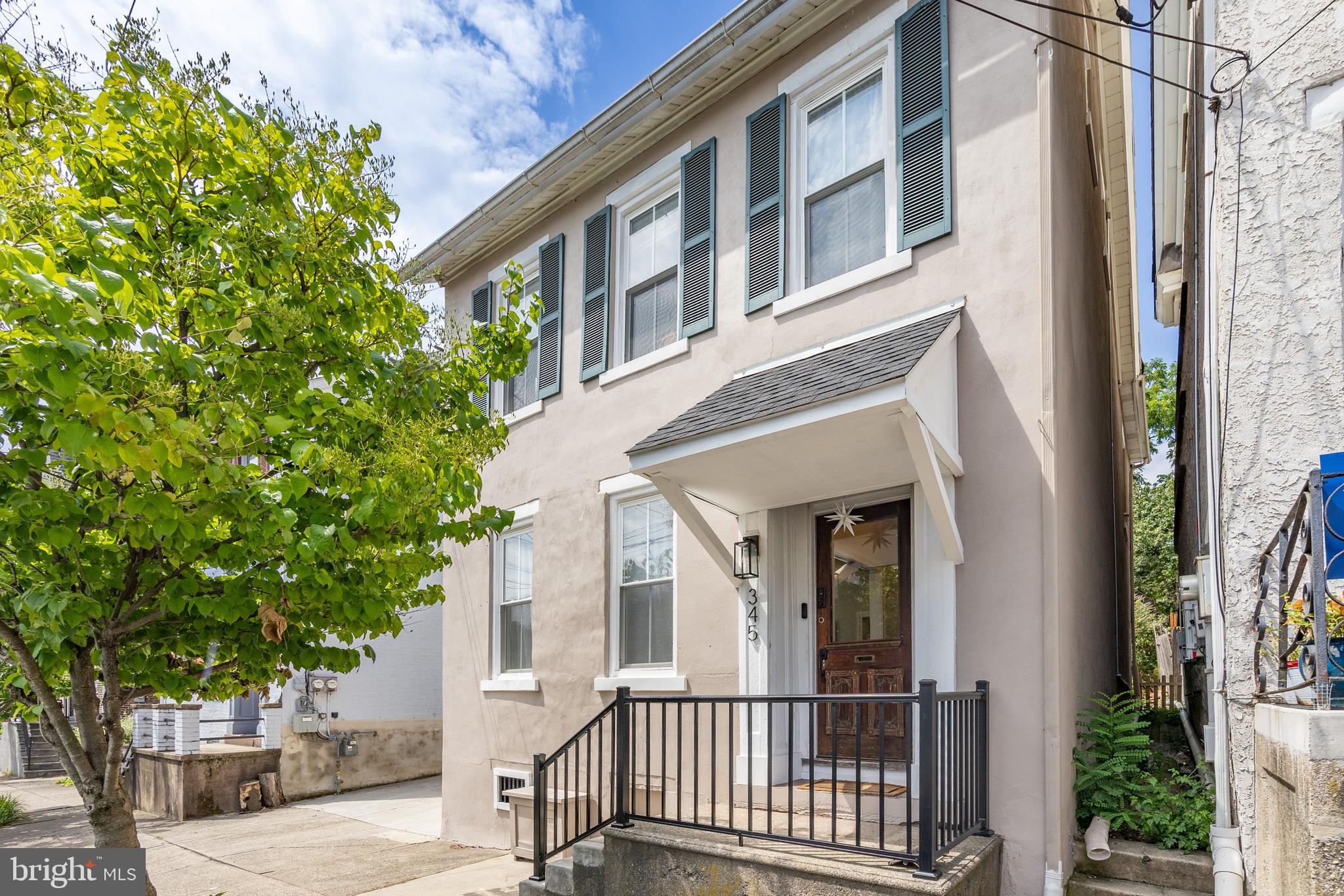 Love to be in the mix of it all? This Bethlehem gem places you just blocks from the world-famous Musikfest and within walking distance to historic downtown, with its vibrant lineup of restaurants, bars, and shops. Enjoy evenings at favorites like Edge, Tapas on Main, and Twisted Olive, or stroll to year-round festivals including Celtic Fest, Sangria Fest, Oktoberfest, and Christmas in Bethlehem. Beyond the walkable lifestyle, you’re only minutes from Target, Wegmans, the Lehigh Valley Mall, and other major retailers—making this the perfect blend of convenience and culture.
A spacious driveway for 2–3 cars, plus street and rear parking, welcomes you home. Step into the foyer where an elegant newel post and railing highlight the home’s craftsmanship. Hardwood floors flow seamlessly through the living room, dining room, kitchen, and sunroom, giving a warm, timeless feel.
The updated kitchen is a centerpiece, featuring shaker-style soft-close cabinetry, granite countertops, an undermount sink with updated faucet and filtered water spout, and stainless steel appliances: a 4-burner gas oven with griddle, built-in microwave, side-by-side refrigerator, and dishwasher. A center island with stool seating, chic chandelier, 9’ ceilings, and abundant natural light create a perfect gathering spot. The adjoining sunroom—with a slider to the backyard—makes an inviting space for coffee or casual meals. A stylish powder room completes the first floor.
The open living and dining space combines classic wood trim, deep window sills, modern lighting, and a mounted TV setup—ideal for both entertaining and relaxing.
Upstairs, the primary bedroom has a custom barn door and hardware leading to a convenient laundry area. Smart blinds, a sleek “fandelier,” and an ensuite with tile flooring, custom shelving, deep soaking tub with glass doors, and striking black fixtures make this space so inviting. The second bedroom has been converted into a luxe walk-in closet with chandelier (easily returned to a bedroom), while the third bedroom features a fandelier and a view of the beautiful Moravian Church. A freshly updated hall bath with a tub, white vanity with drawers, and tile flooring serves the additional bedrooms.
The clean, spacious attic offers storage or potential to finish for more living space. The basement—with Bilco doors and past use as a woodshop—adds versatility.
Out back, discover your peaceful oasis in the city: a lush yard with a lovely patio, gardens, greenhouse, and plenty of room to host friends or enjoy quiet evenings. Perfect for entertaining or the garden enthusiast.
This home combines the solid craftsmanship of an older build with the comfort of modern updates and finishes—all in a location where you can embrace Bethlehem’s rich culture, festivals, and dining scene while enjoying the calm of your own backyard retreat.