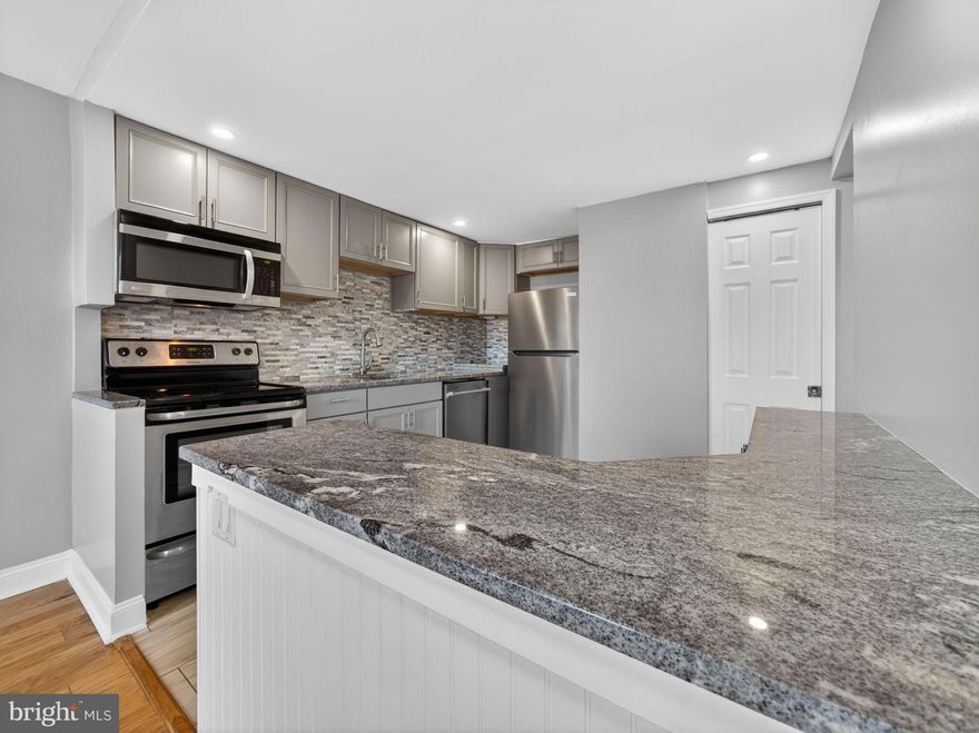 Welcome to 256 Arbour Court, tastefully renovated and refreshed from top to bottom, and tucked away in a quiet area of the Gwynedd Club community. The main level welcomes you with beautiful engineered hardwood floors and a neutral color palette, creating a bright and cohesive atmosphere that defines the entire living space. The kitchen serves as a functional centerpiece, featuring granite countertops, a classic tile backsplash, and brand-new refrigerator and dishwasher. A thoughtful design choice is the use of undermounted outlets; by tucking them beneath the cabinetry, the tilework remains clean and uninterrupted by wall plates. A pantry closet and an extra-large coat and storage closet increase the functionality of the space, and a modern renovated half bath completes this first-floor layout. Throughout the home energy-efficient and easy to clean windows invite an abundance of natural light, and maintain a quiet, well-insulated interior. When it’s time to step outside, the living space extends to a private, enclosed patio with a low-maintenance Trex deck—a perfect retreat for a quiet morning coffee or evening relaxation.  Heading upstairs, you’ll find two spacious bedrooms featuring plush carpeting, ceiling fans, generous closet space, and a dedicated linen closet, offering additional storage. The sleek, updated, full bath has been finished with modern tile work, echoing the home’s polished aesthetic. For added convenience, the laundry area is conveniently located on the second floor and includes a full-sized washer and dryer.  The home is situated within the highly regarded North Penn School District and offers convenient access to the dining and shopping of North Wales, Lansdale, and Montgomeryville, as well as the walking trails and pickleball courts at Parkside Place Park. With easy access to the North Wales and Lansdale SEPTA stations and major commuter routes, the location offers a great blend of suburban tranquility and modern accessibility.